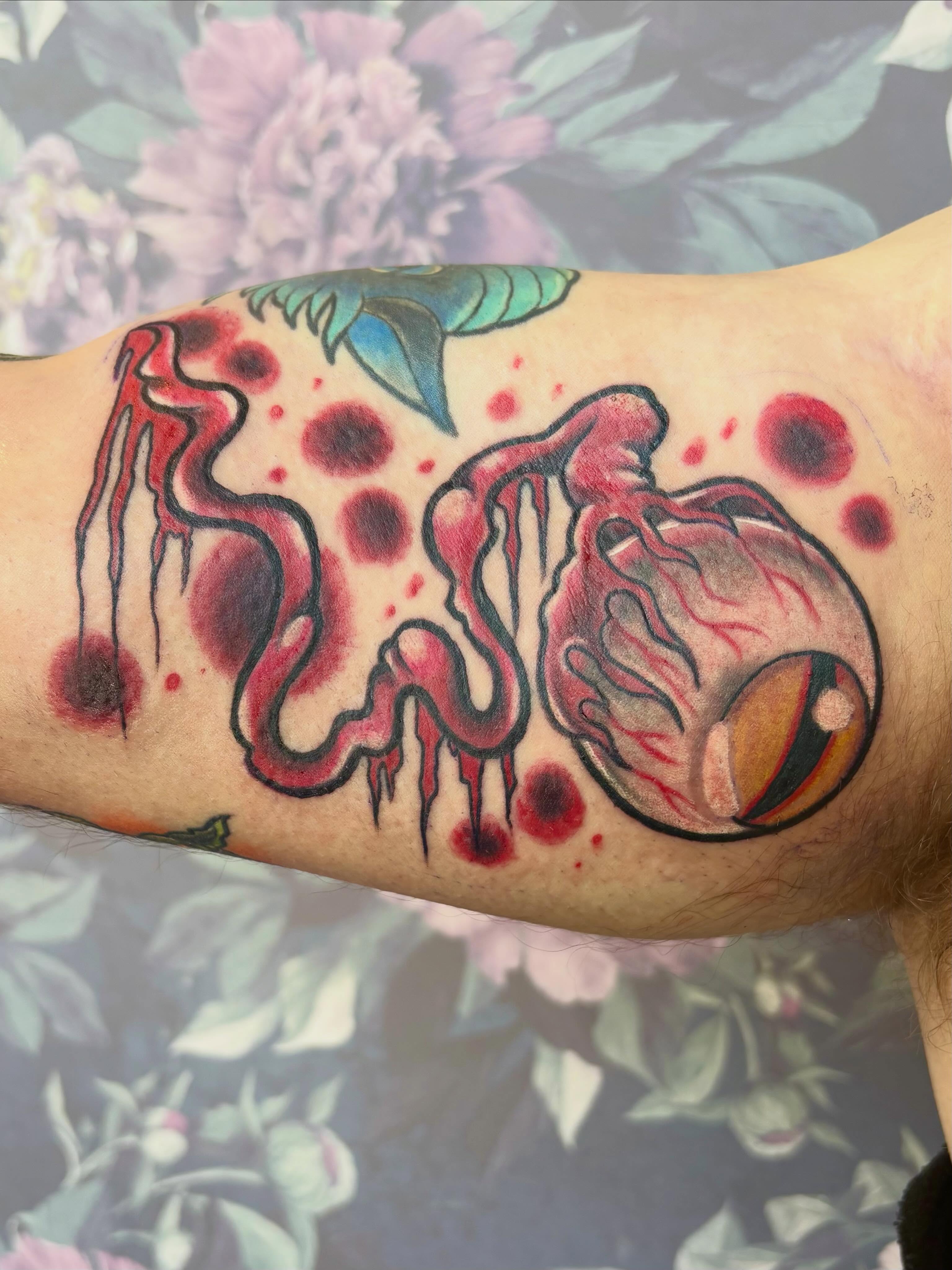 Eye with jellyfish American traditional tattoo on the forearm by Bre Alex