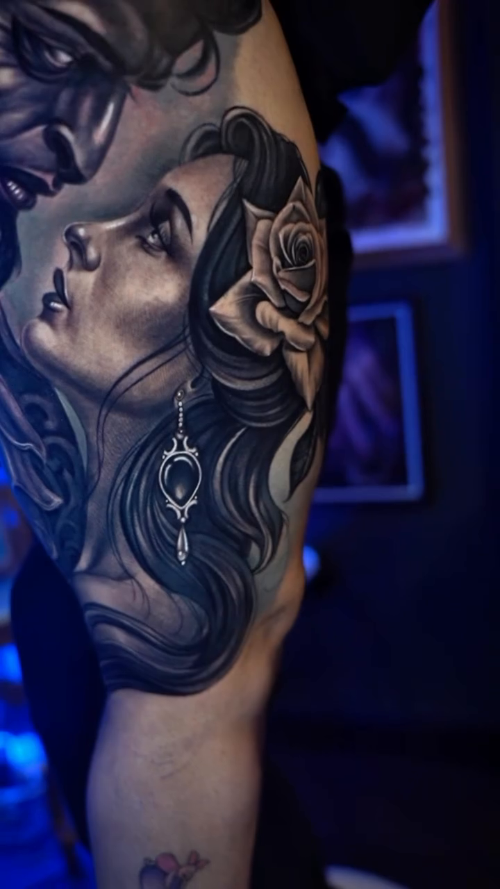 Two faces in profile realism tattoo by Cristian Rodriguez