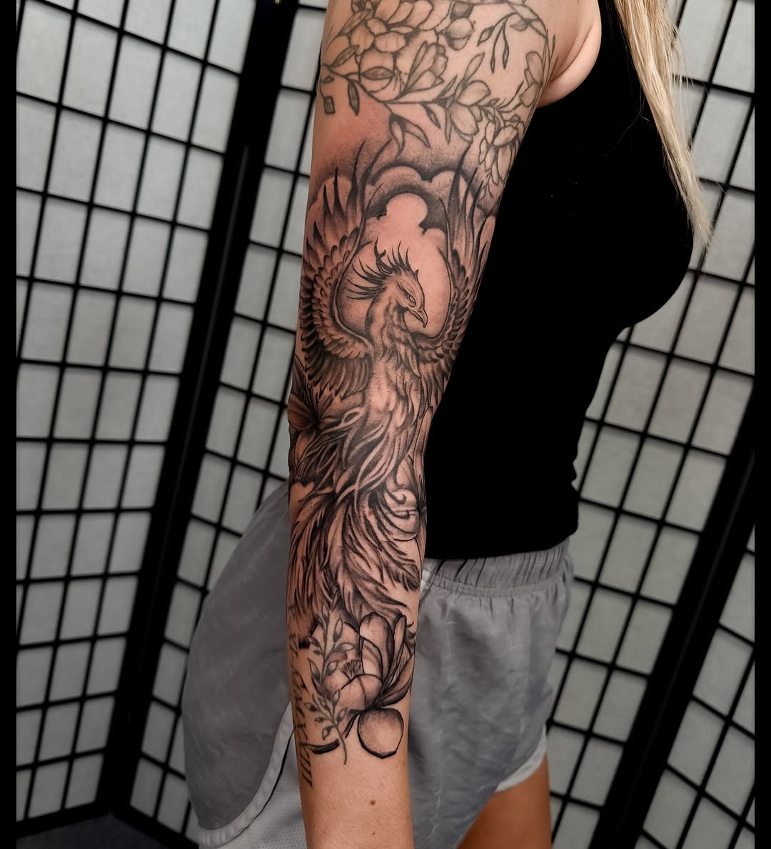 Phoenix realism tattoo on the forearm by Noah Morris