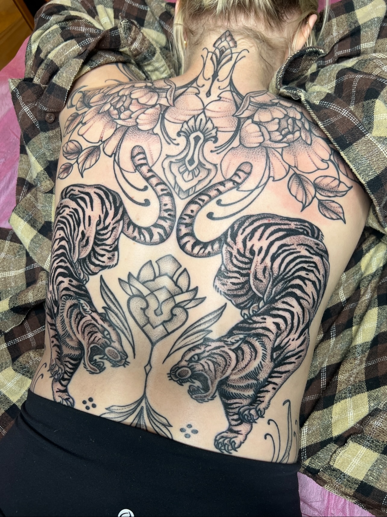 Tiger and floral black and grey tattoo on the back by Bri Leflore