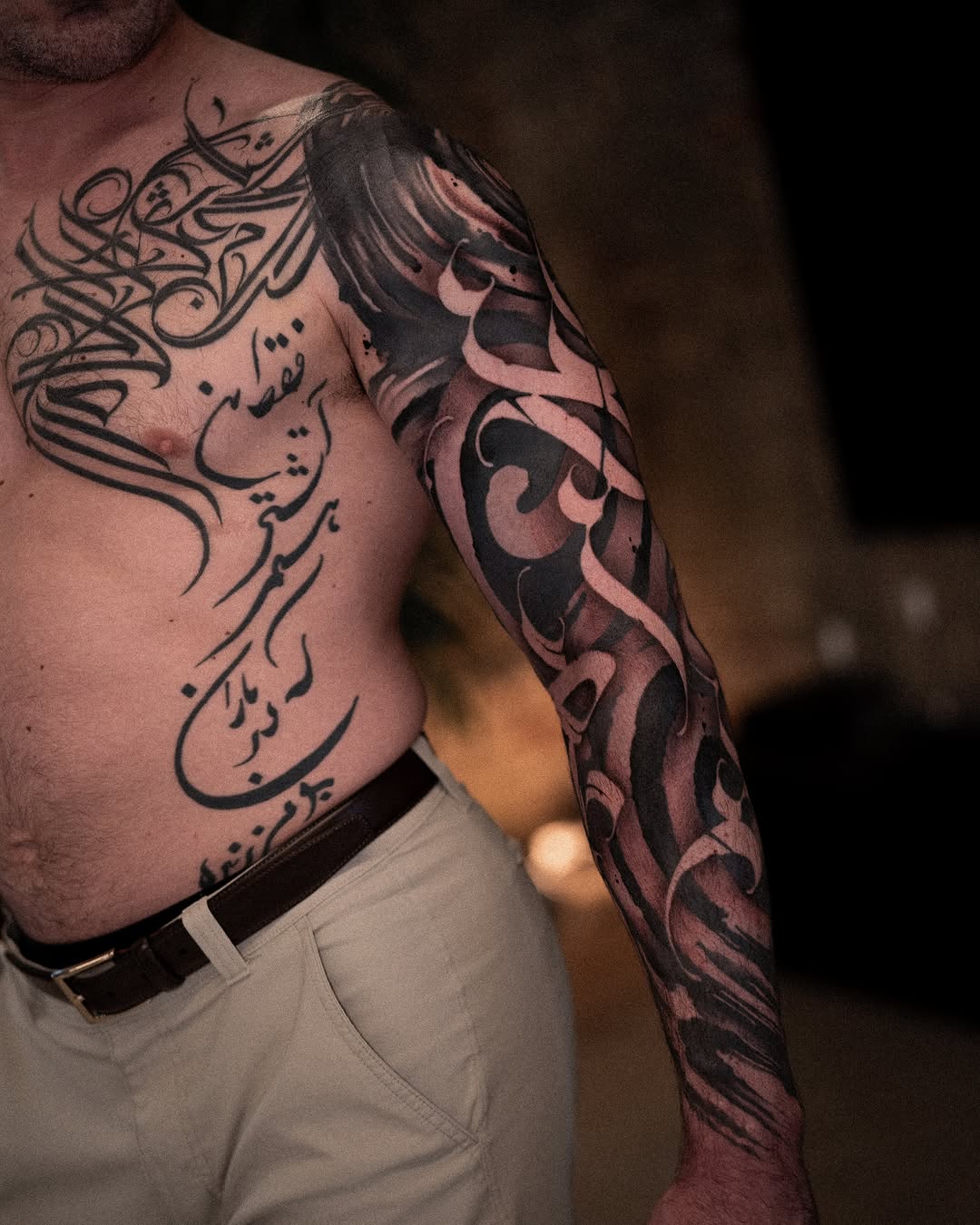 Calligraphy Chicano tattoo on the chest by Low, Brooklyn, New York