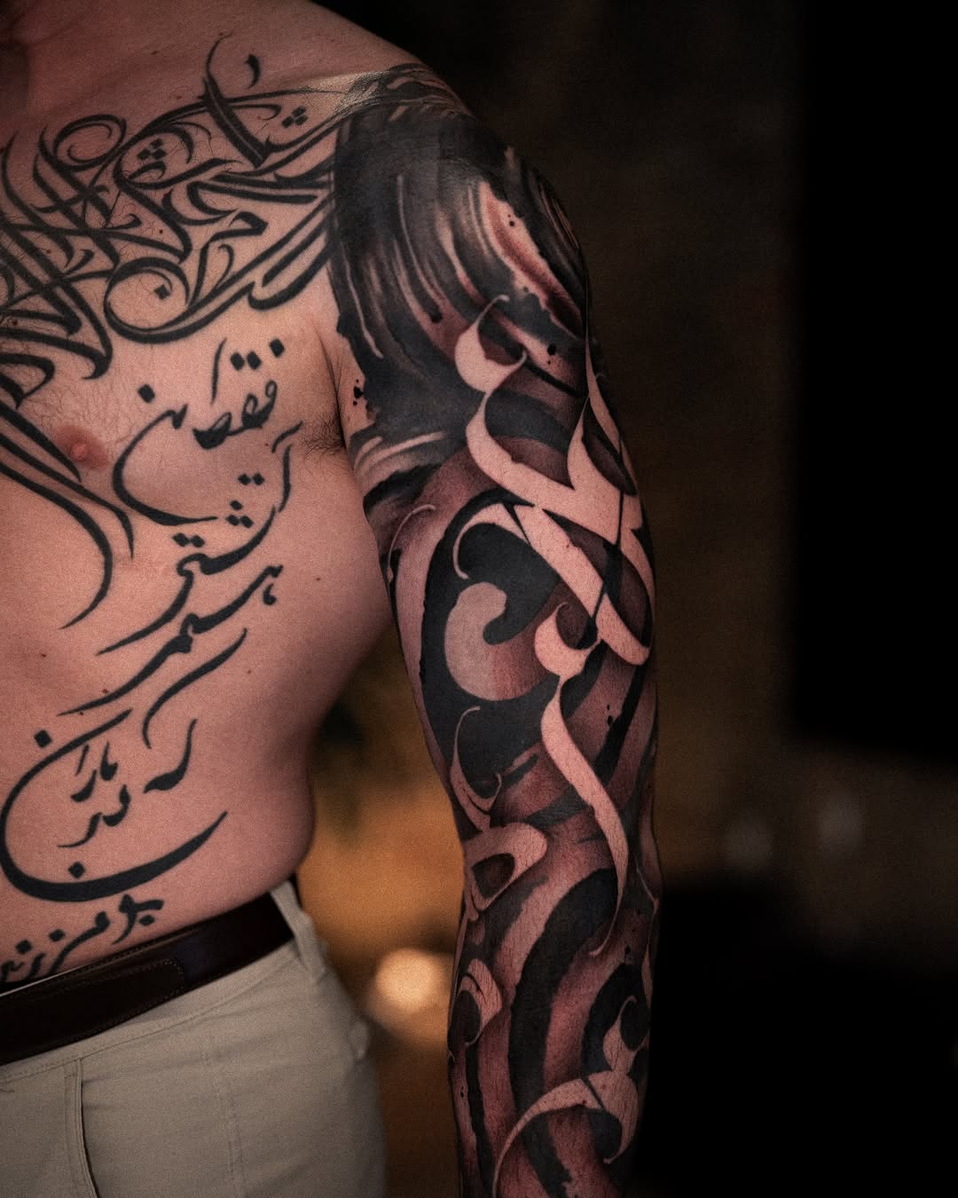Arabic calligraphy Chicano tattoo on the upper arm by Low, Brooklyn, New York