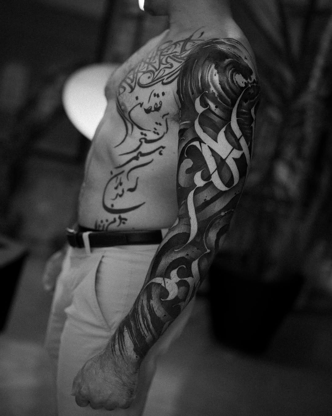 Arabic calligraphy Japanese tattoo on the upper arm by Low, Brooklyn, New York