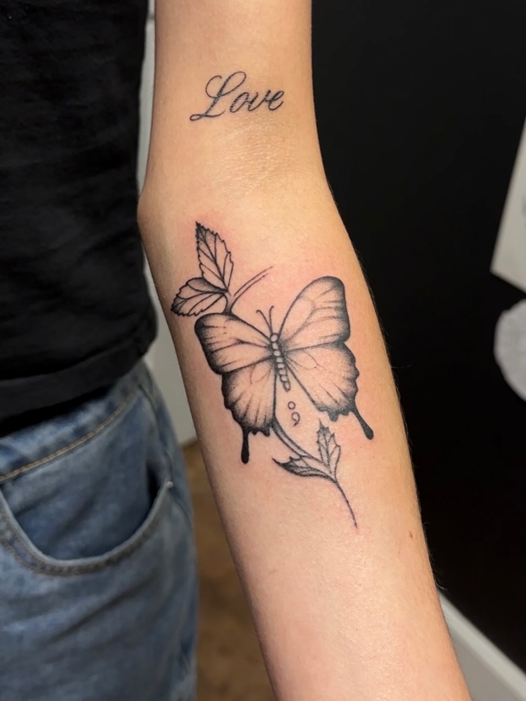 Butterfly black and grey tattoo on the forearm by Jocelyn
