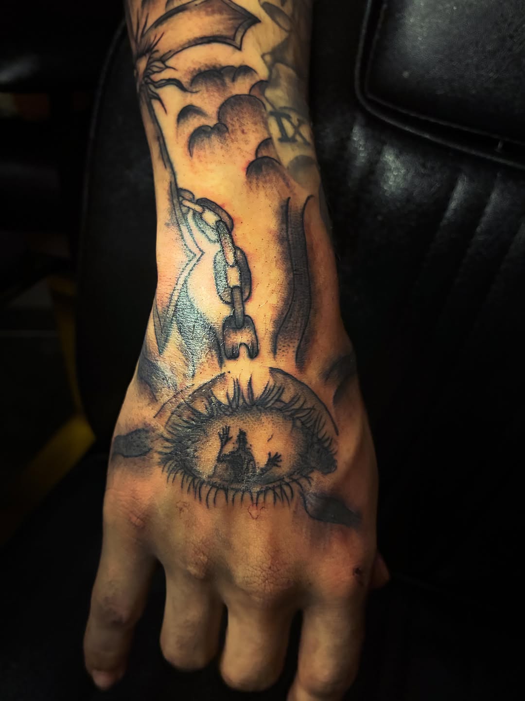 Eye with figures inside and chain dark art tattoo on the hand by ɪɪɴᴋᴇᴅʙʏʀᴇɴɴ🐉