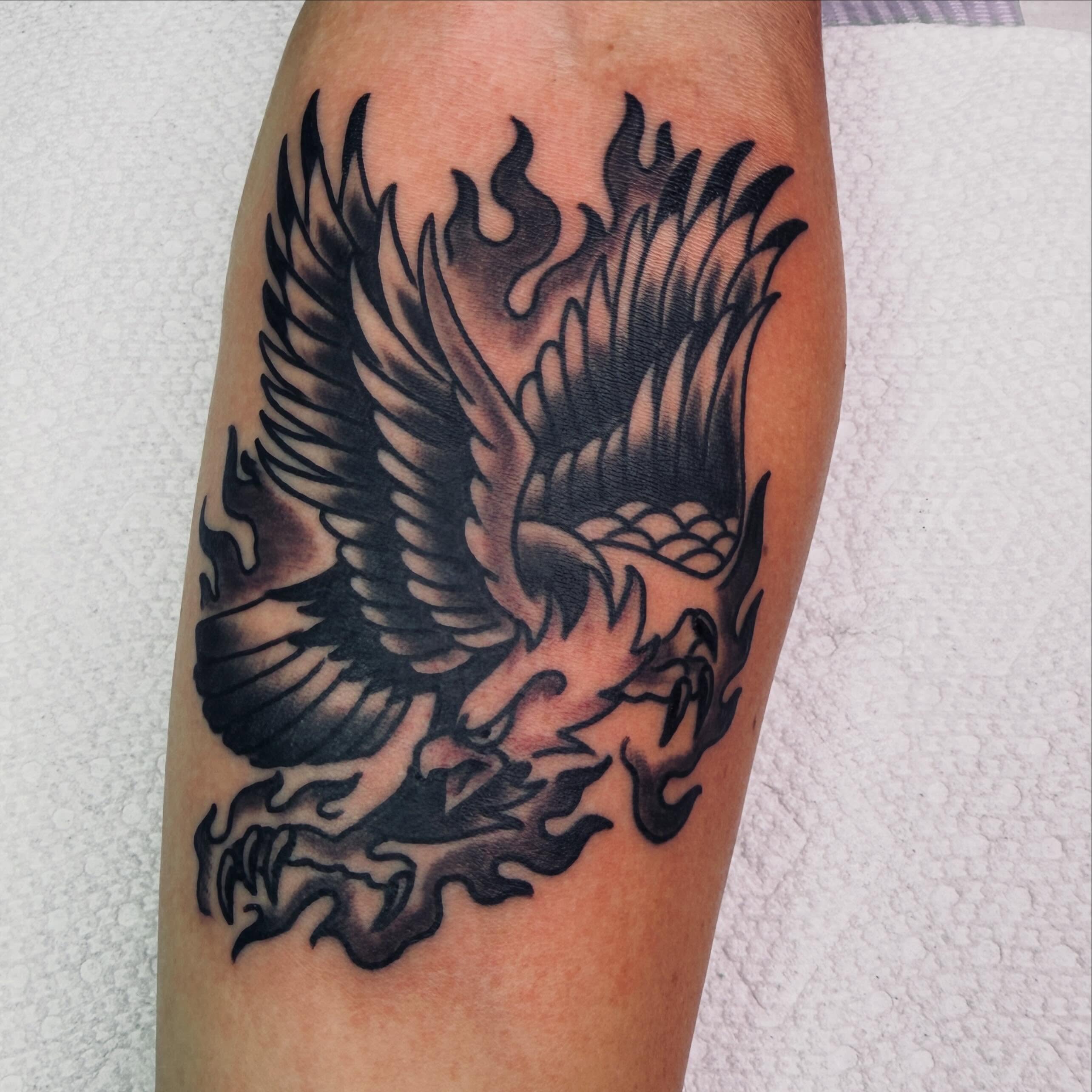 Phoenix American traditional tattoo on the forearm by Steven Blackheart