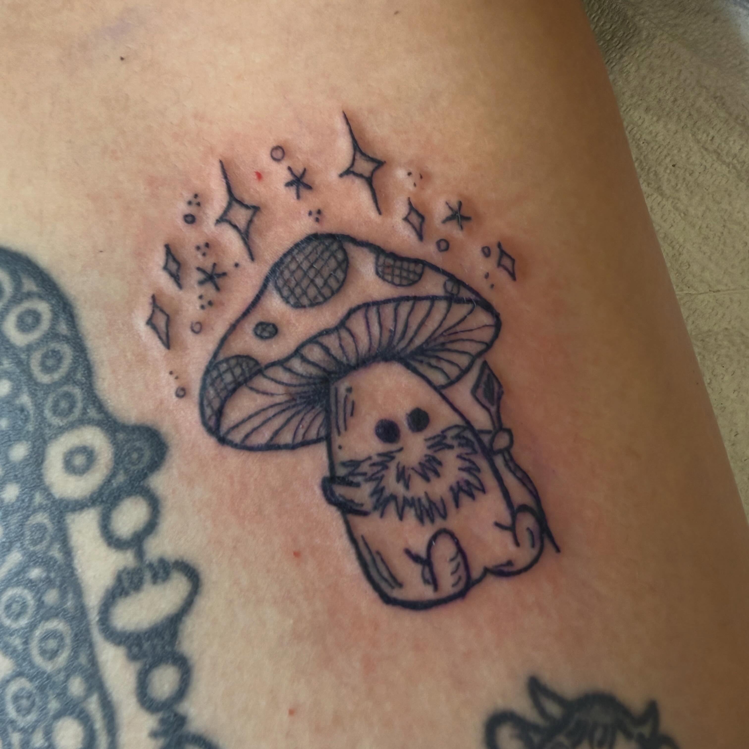 Mushroom and gnome black and grey tattoo on the thigh by Eric Guntor, Philadelphia, Pennsylvania