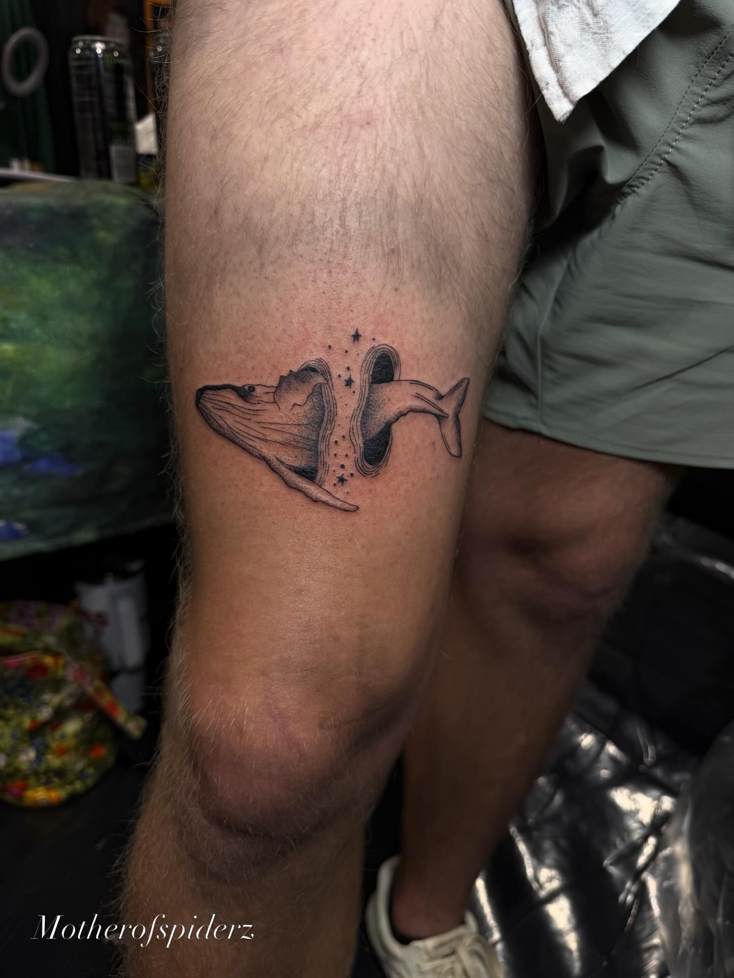 Whale and dolphin dotwork tattoo on the leg by Alyssa Garza