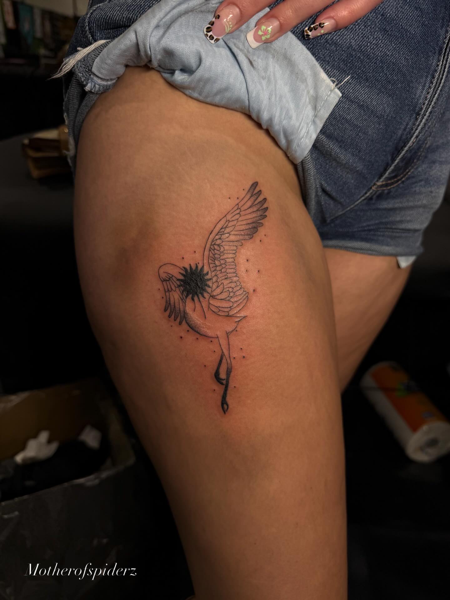 Bird with sun dotwork tattoo on the thigh by Alyssa Garza