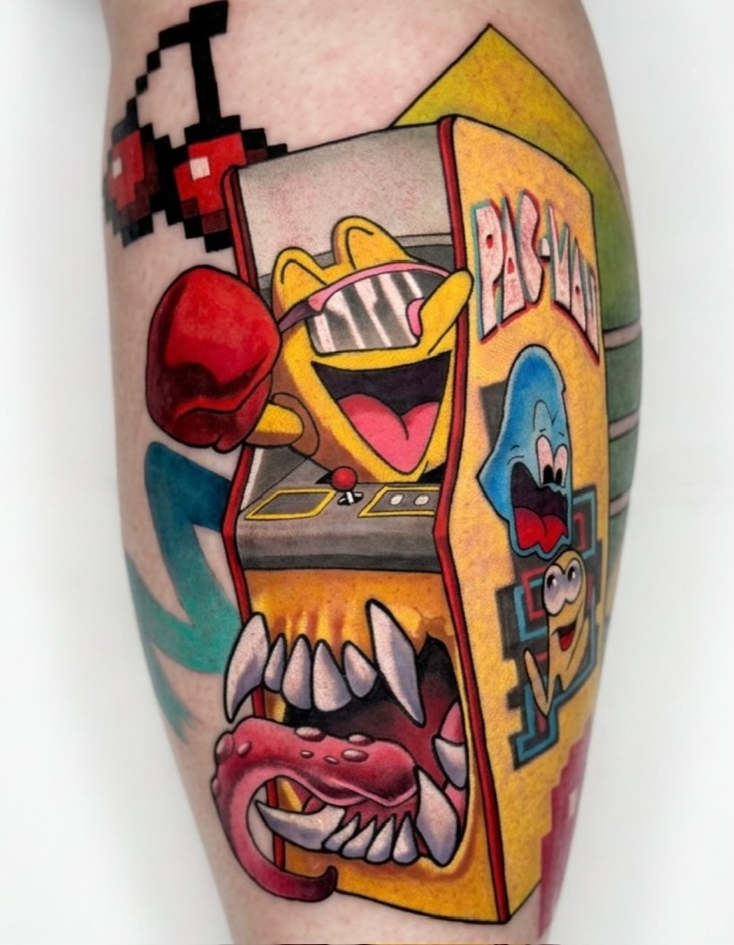 Pac-Man arcade machine with characters new school tattoo on the forearm by Tattoo Bam Bam
