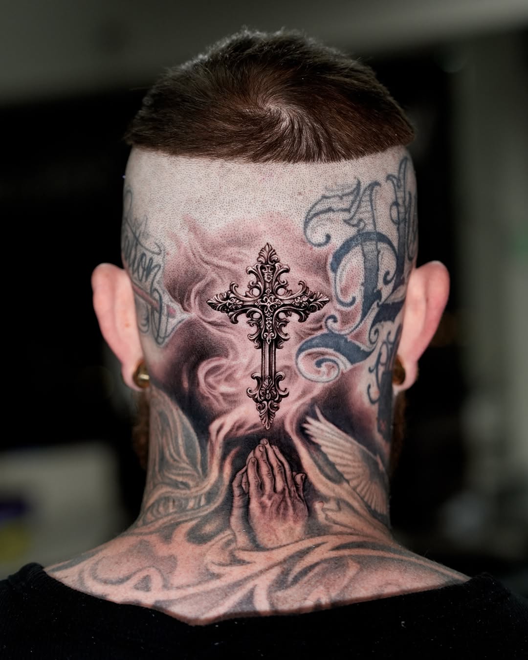 Ornate cross with praying hands realism tattoo on the neck by Gody