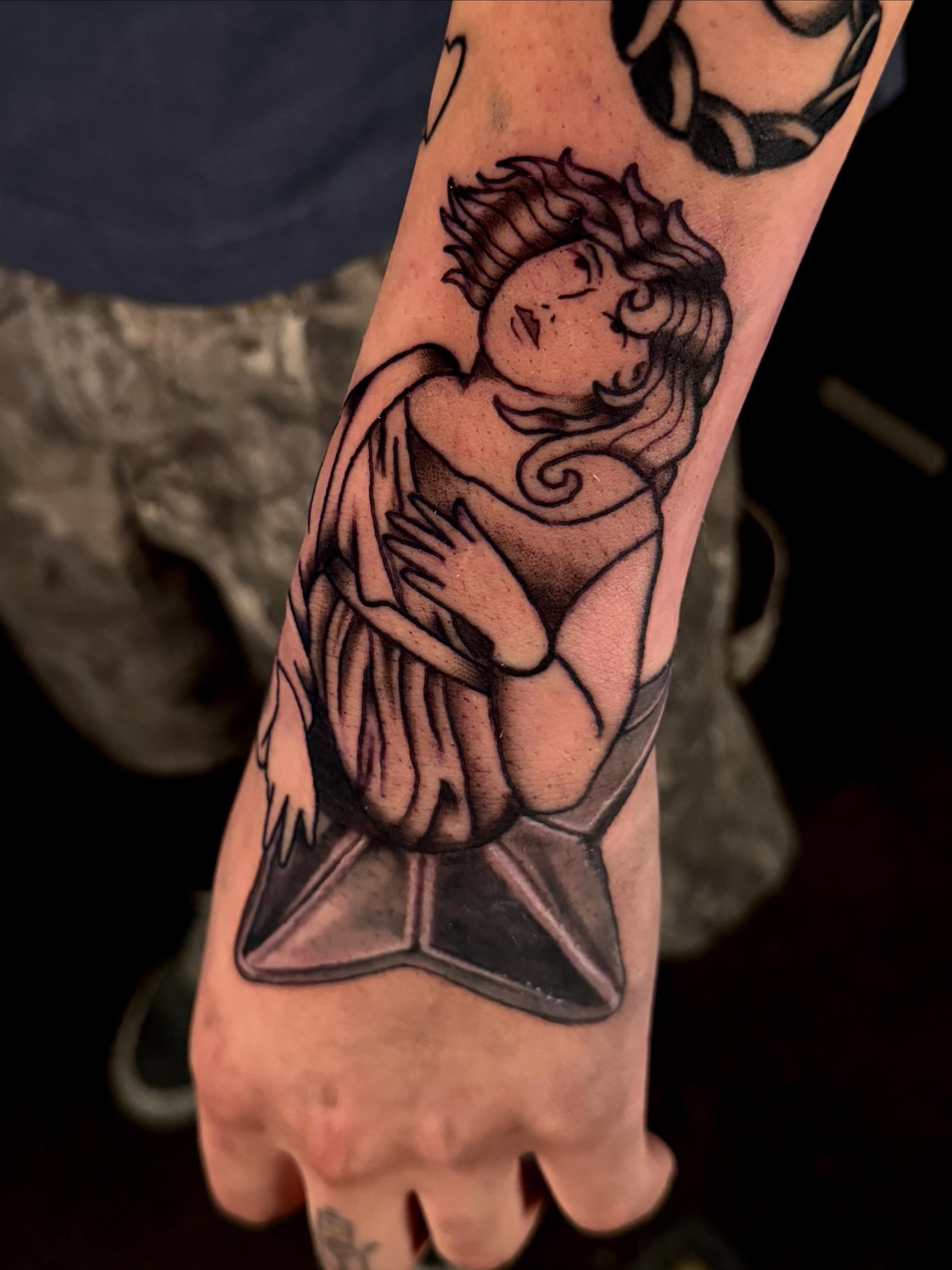 Angel black and grey tattoo on the forearm by Dallas Tattoo Artist