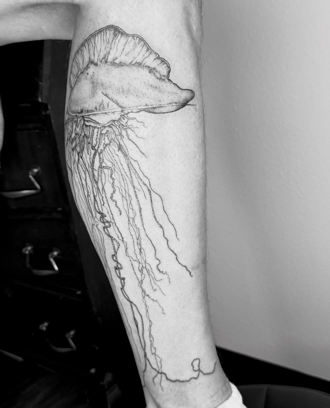 Jellyfish black and grey tattoo on the forearm by Ashley Limon