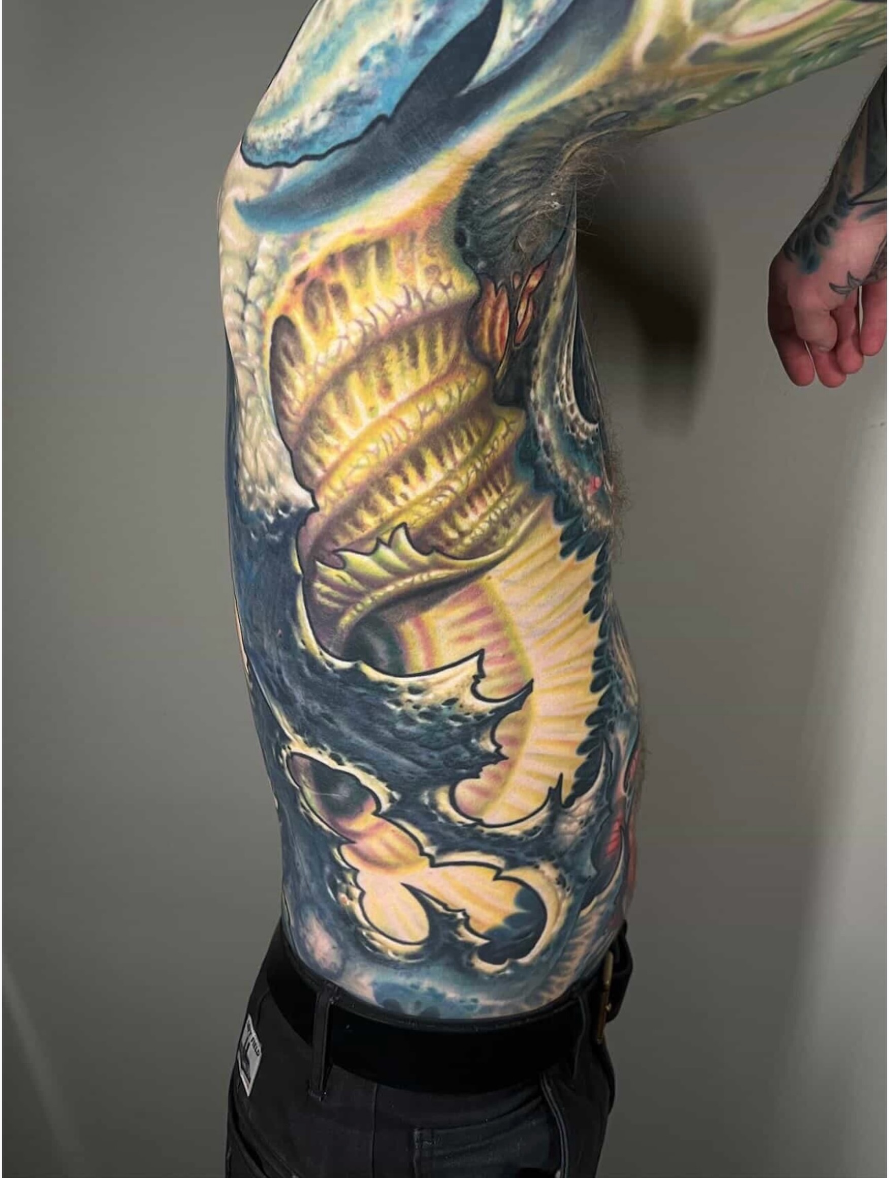 Serpent realism tattoo on the upper arm by Ty McEwen Tattoo Artist │ Bioorganic │