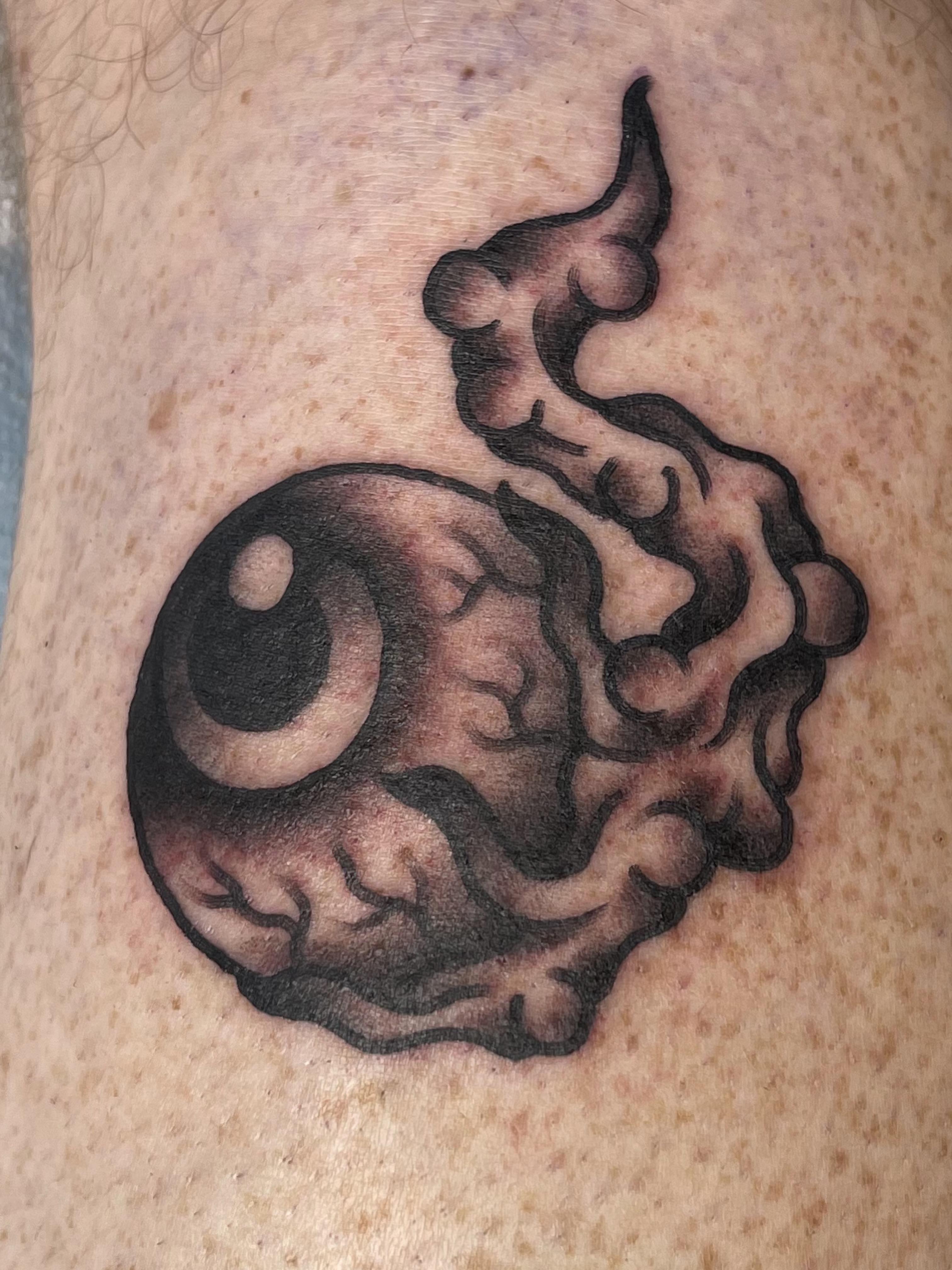 Eye and flame black and grey tattoo on the forearm by Chris Martin