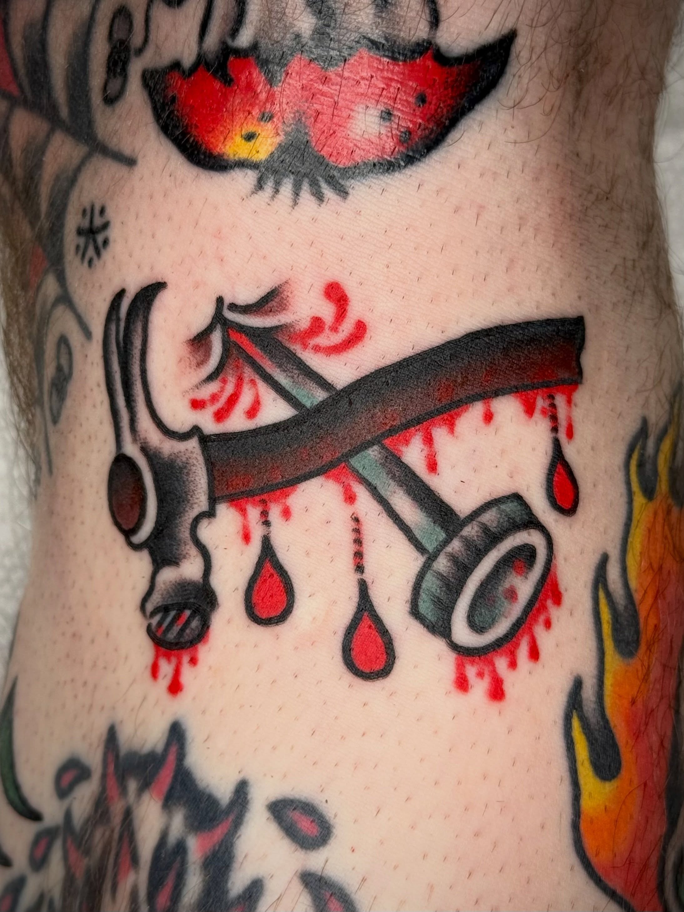 Hammer with blood American traditional tattoo on the forearm by Maximilian Harrison