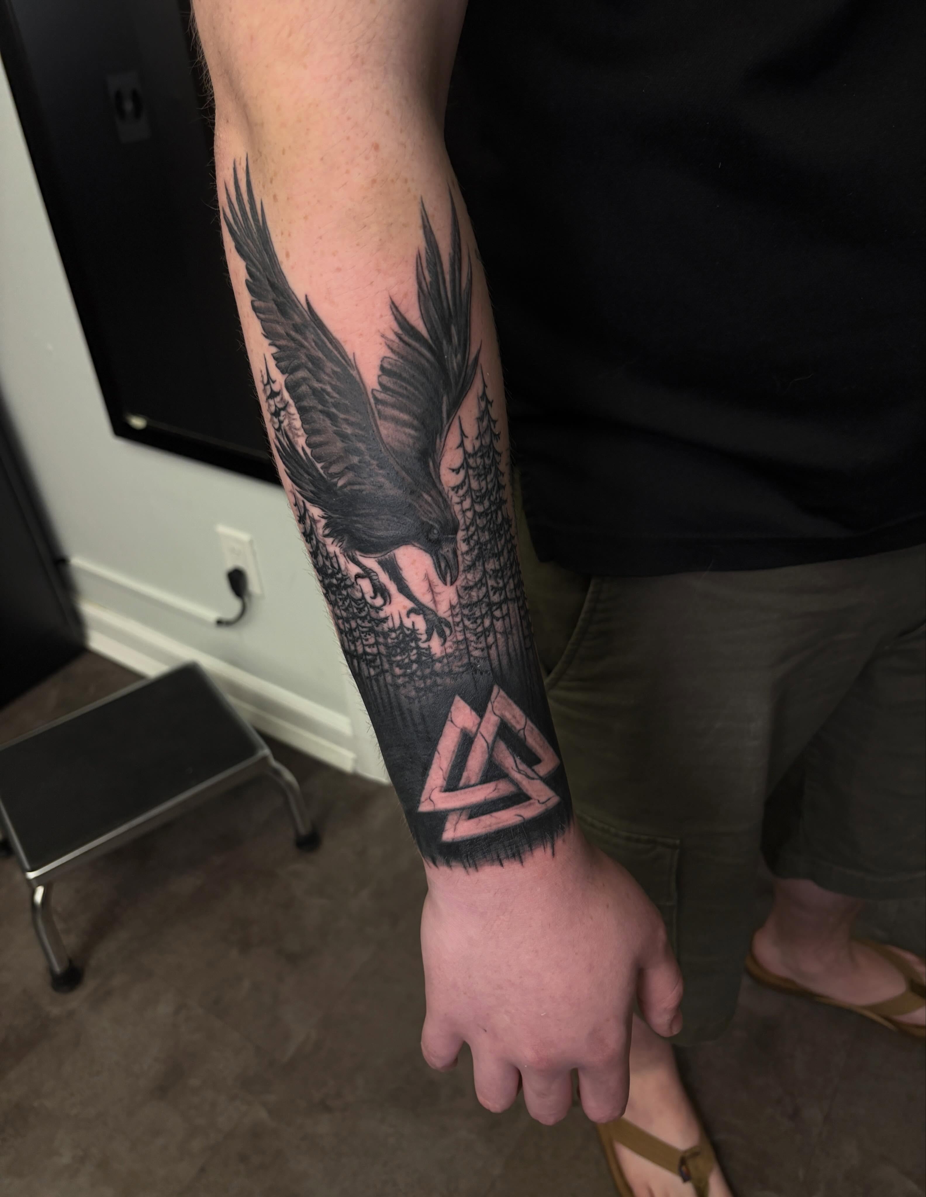 Eagle and triangle geometric tattoo on the forearm by Thea Curlee