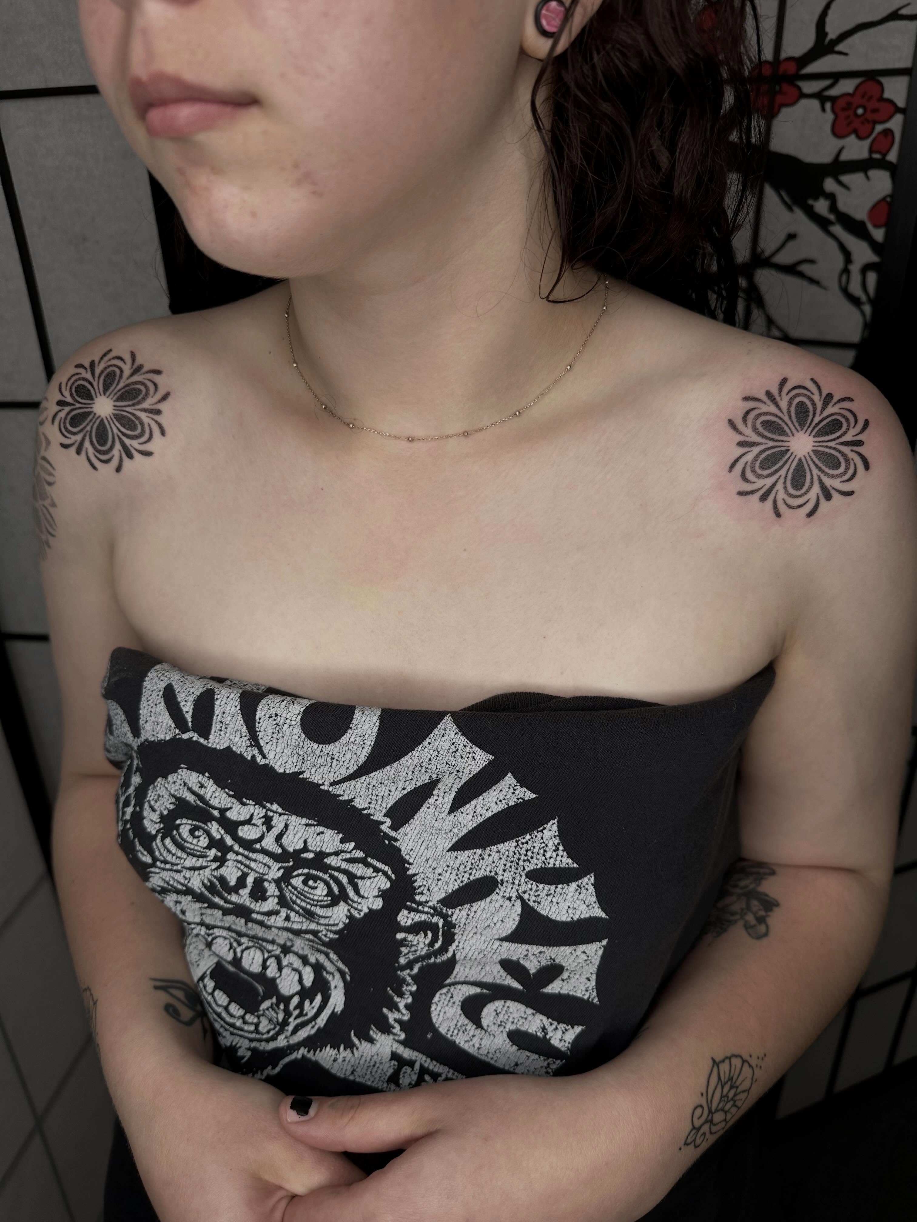 Flower black and grey tattoo on the shoulder by Kat Fishbein