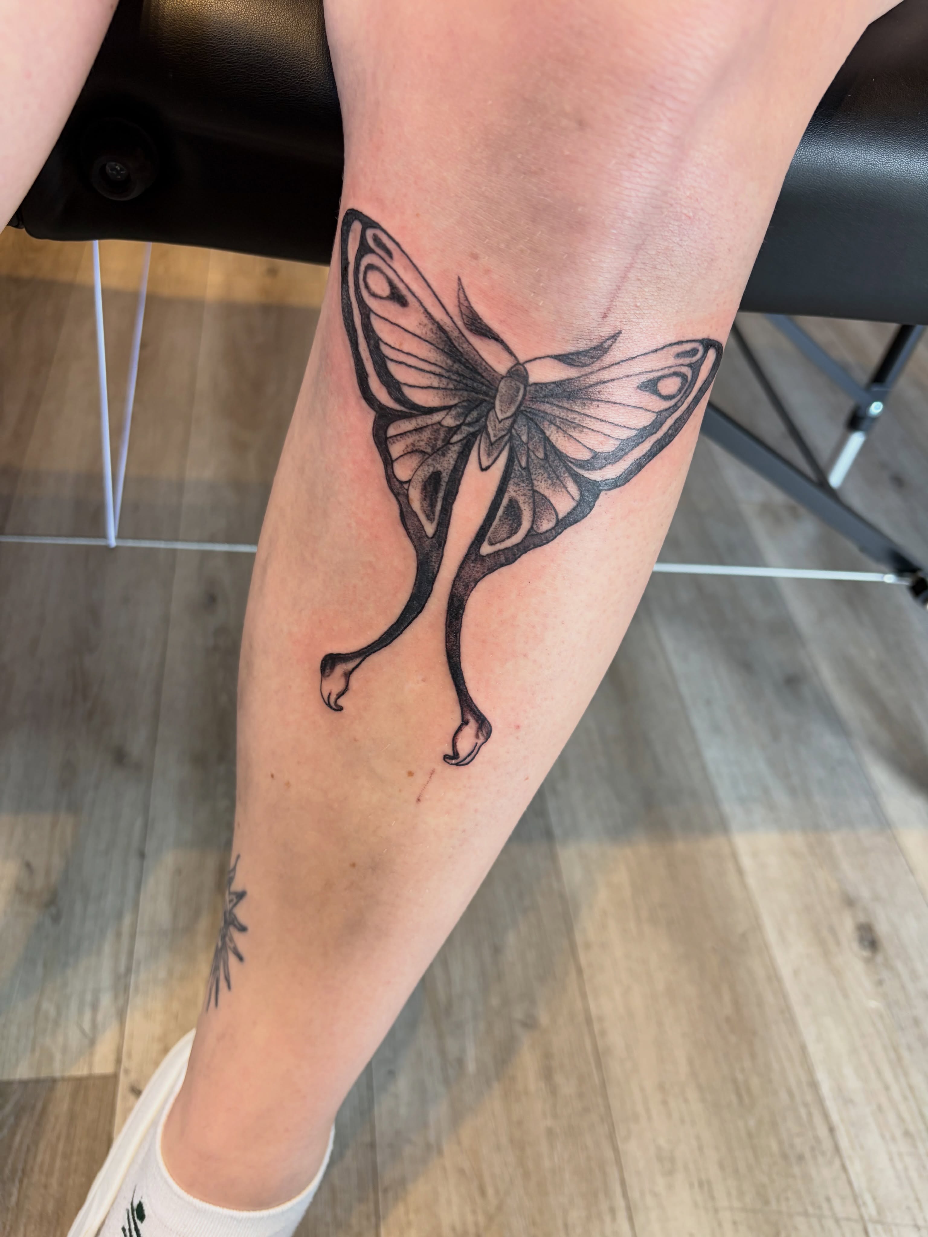 Butterfly black and grey tattoo on the forearm by Calen Copeland