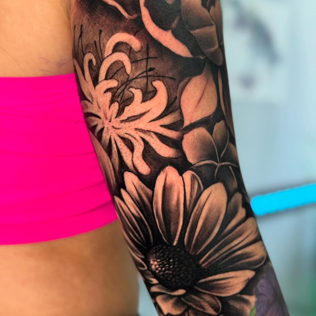 Flowers fine line tattoo on the forearm by Isiah Hall, Whittier, California