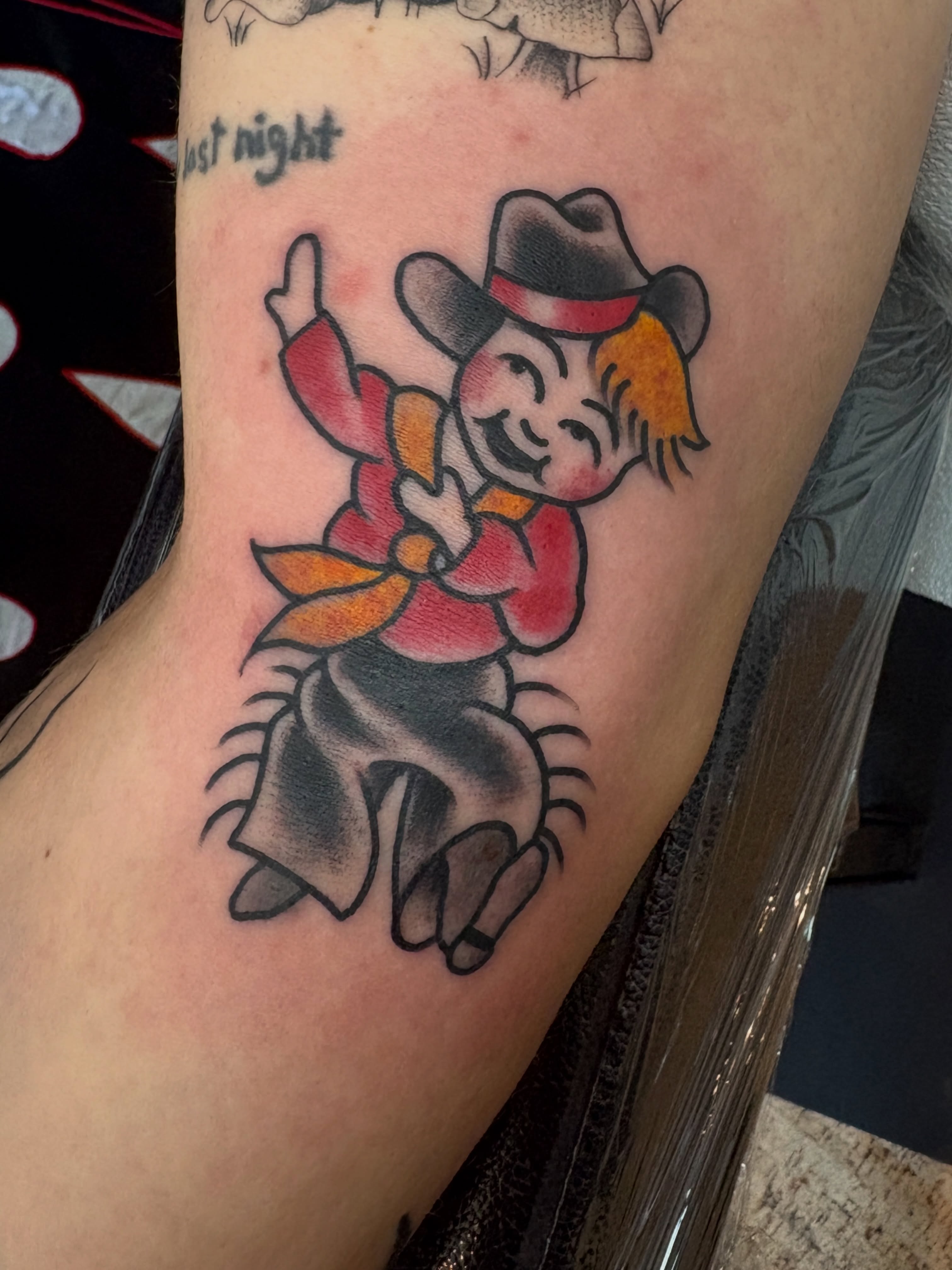 Cowboy character American traditional tattoo on the forearm by Kimber Teatro, Portland, Oregon