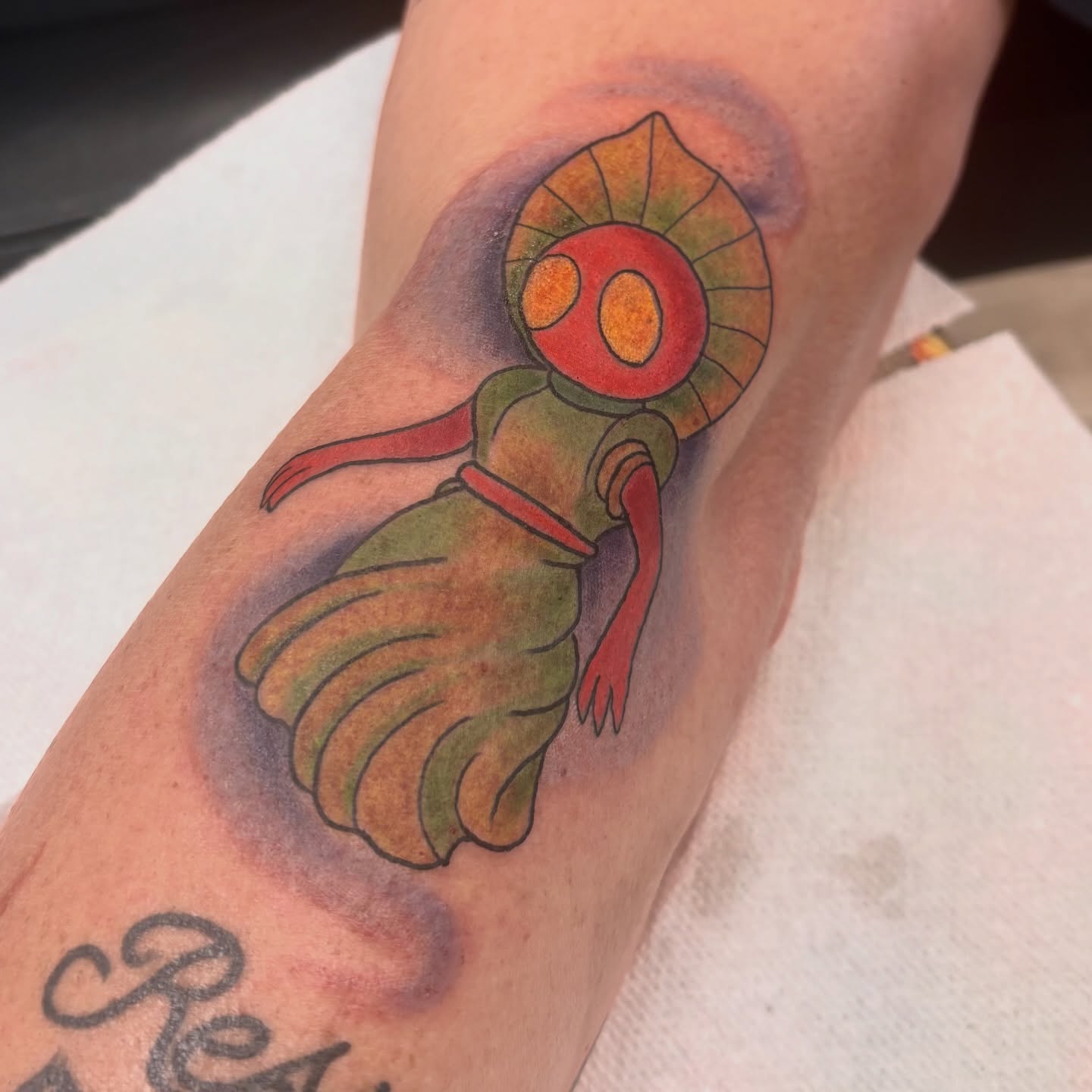 Alien-like creature American traditional tattoo on the forearm by Megan