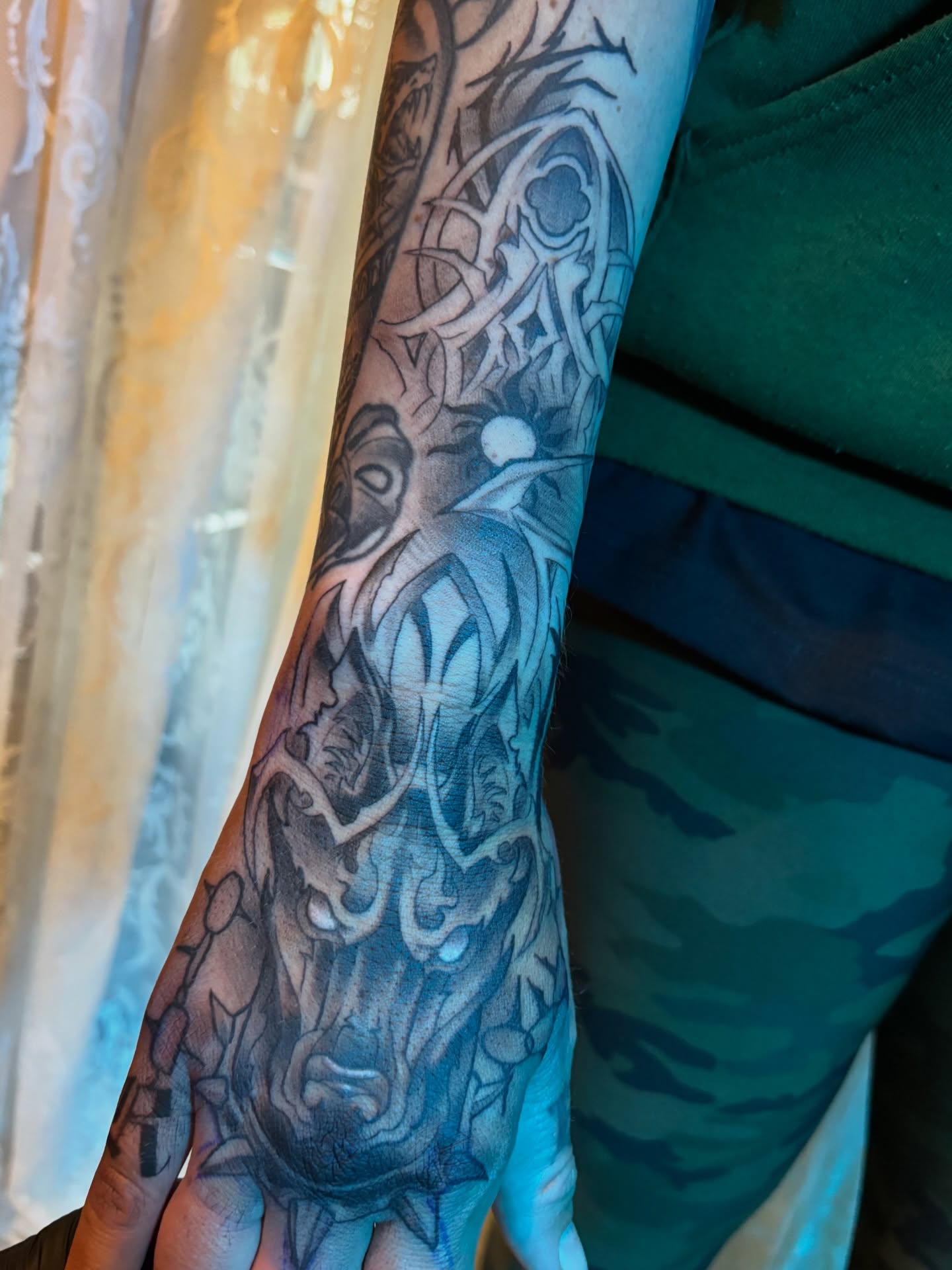 Deer head black and grey tattoo on the forearm by Komfort Kristy