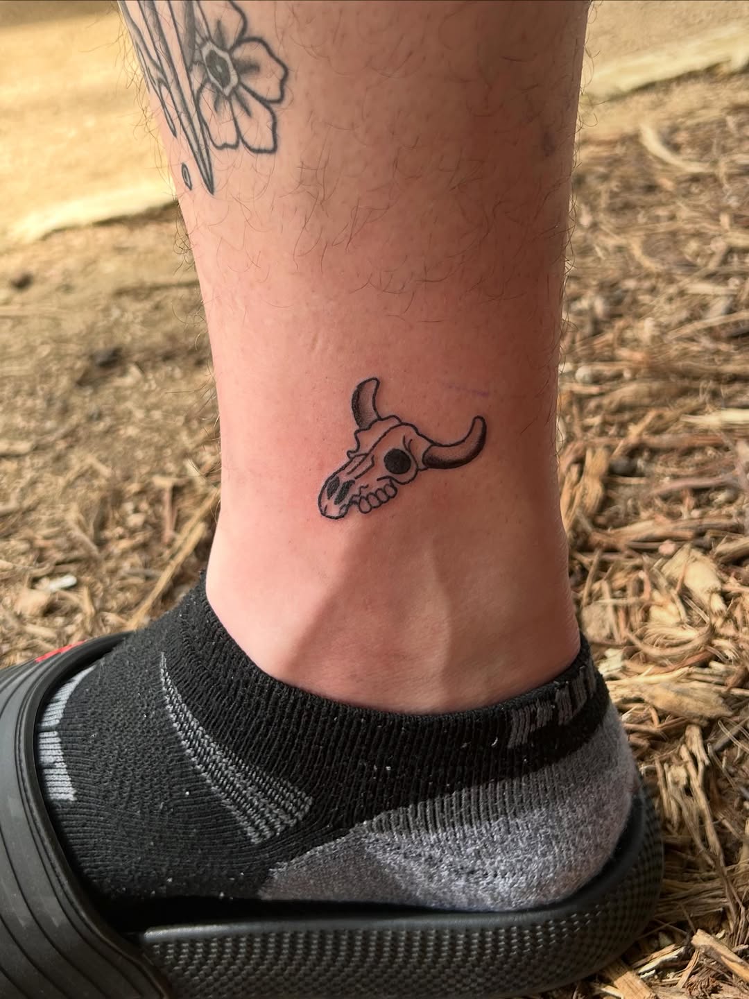 Bull skull minimalist tattoo on the foot by Miss Katie