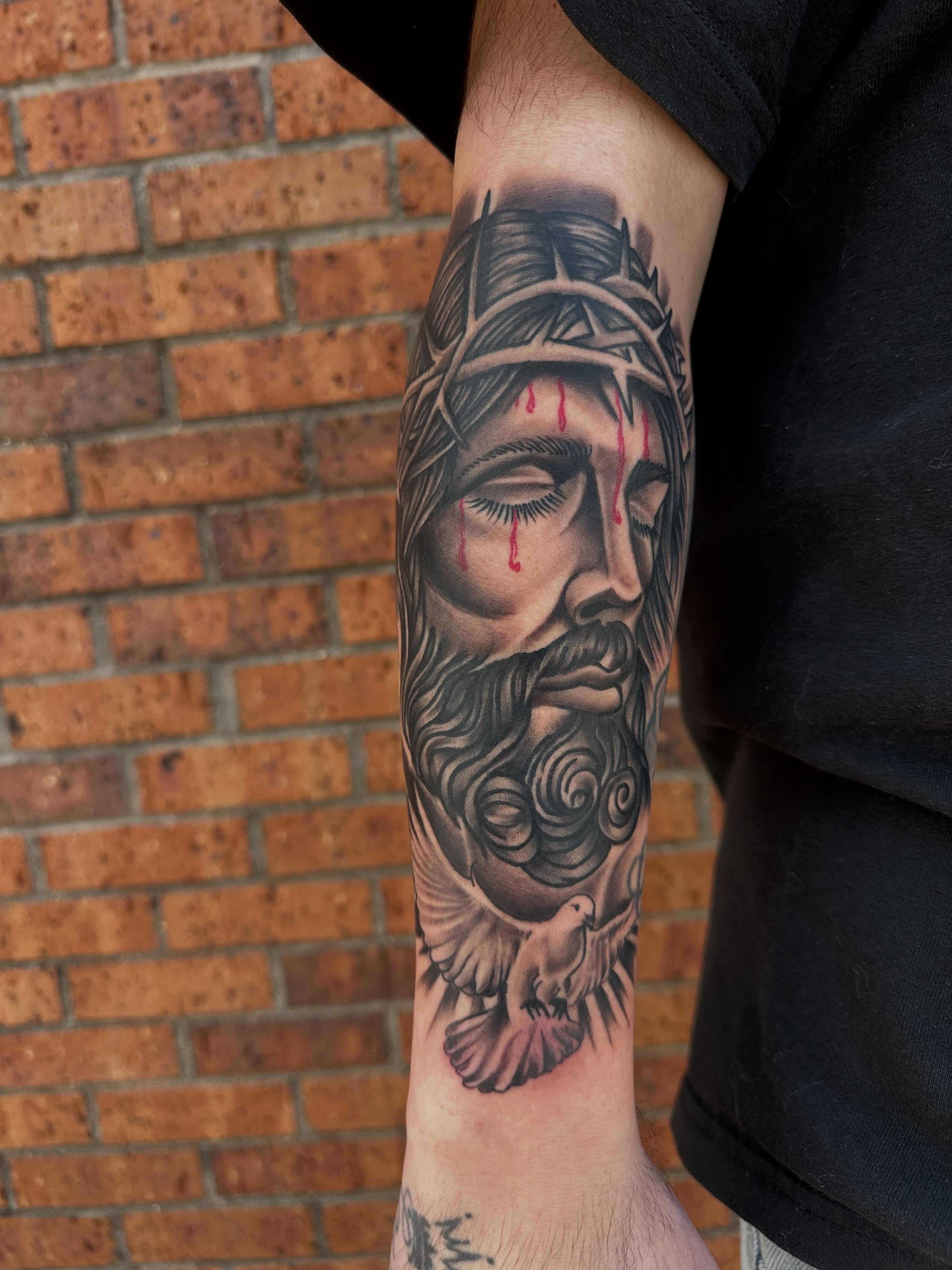 Jesus Christ realism tattoo on the forearm by DFW