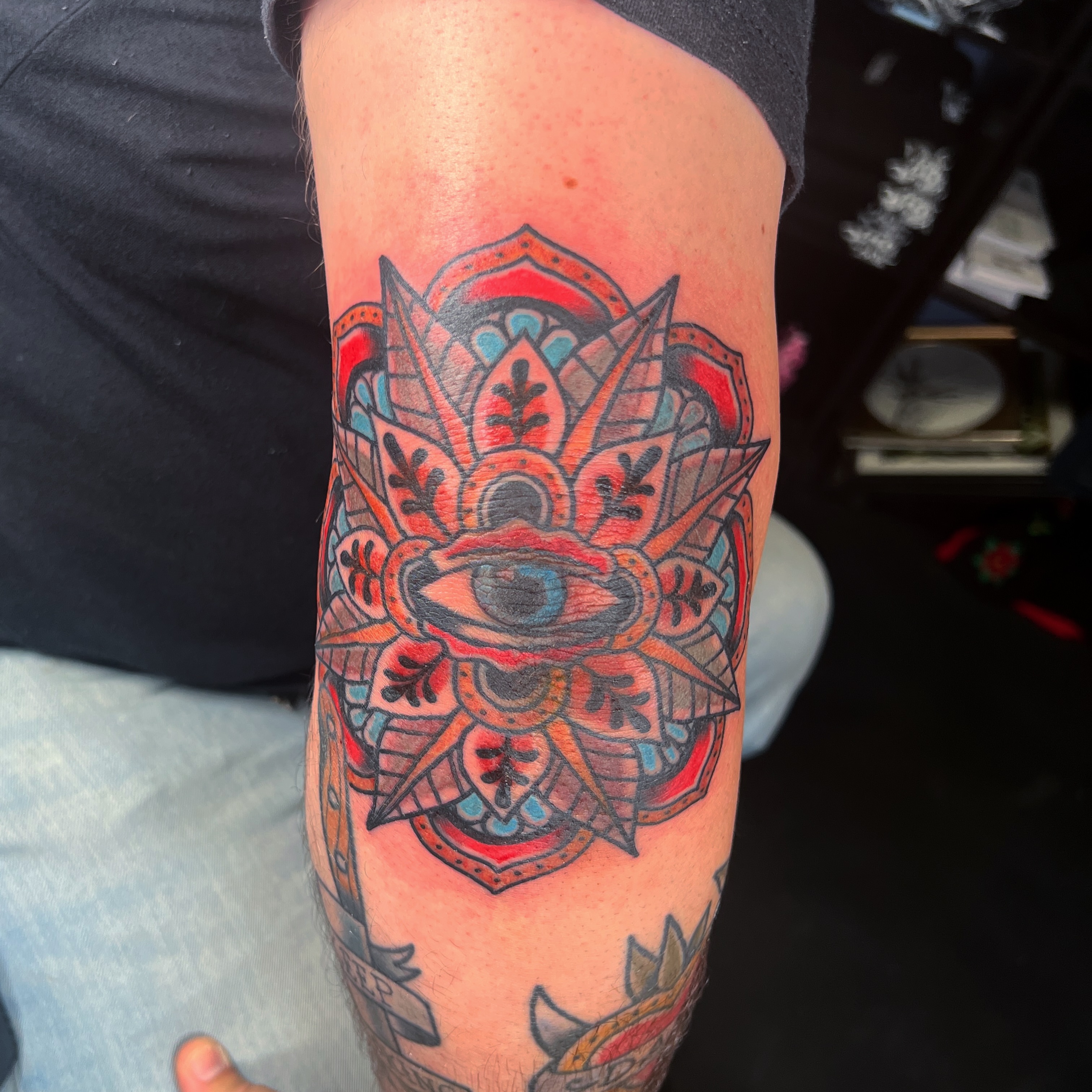 Eye and mandala geometric tattoo on the forearm by Brian Mock