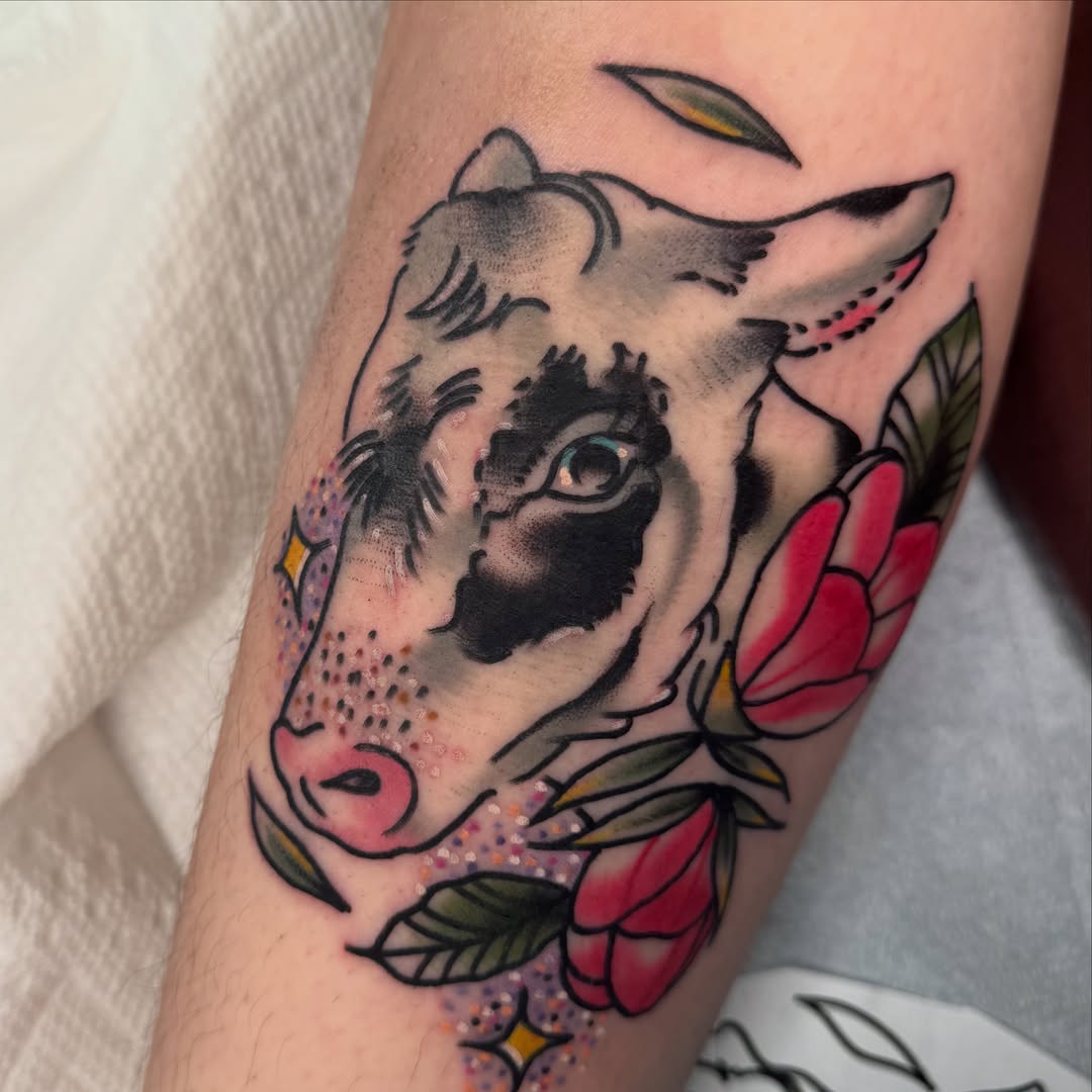 Cow head with flowers American traditional tattoo on the forearm by Kurt Brecheis Jr., Malvern, Pennsylvania