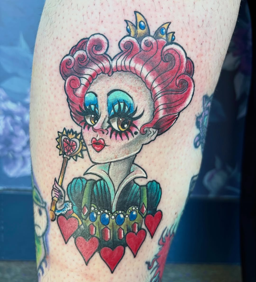 Queen of hearts American traditional tattoo on the thigh by Bre Alex