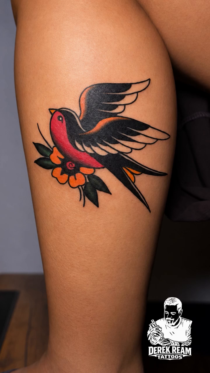 Swallow tattoo with flowers fine line tattoo on the leg by Derek Ream