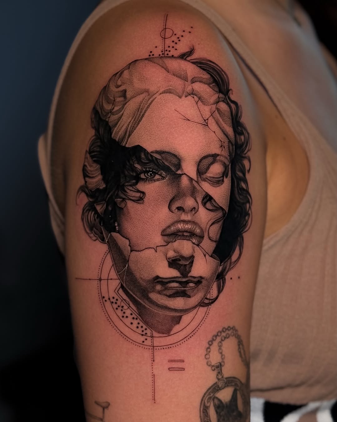 Broken statue face surrealism tattoo on the upper arm by ♡ 𝕍𝕚𝕔𝕥𝕠𝕣𝕚𝕒 ℍ𝕠𝕝𝕞𝕖𝕤 ♡, Avon, Ohio