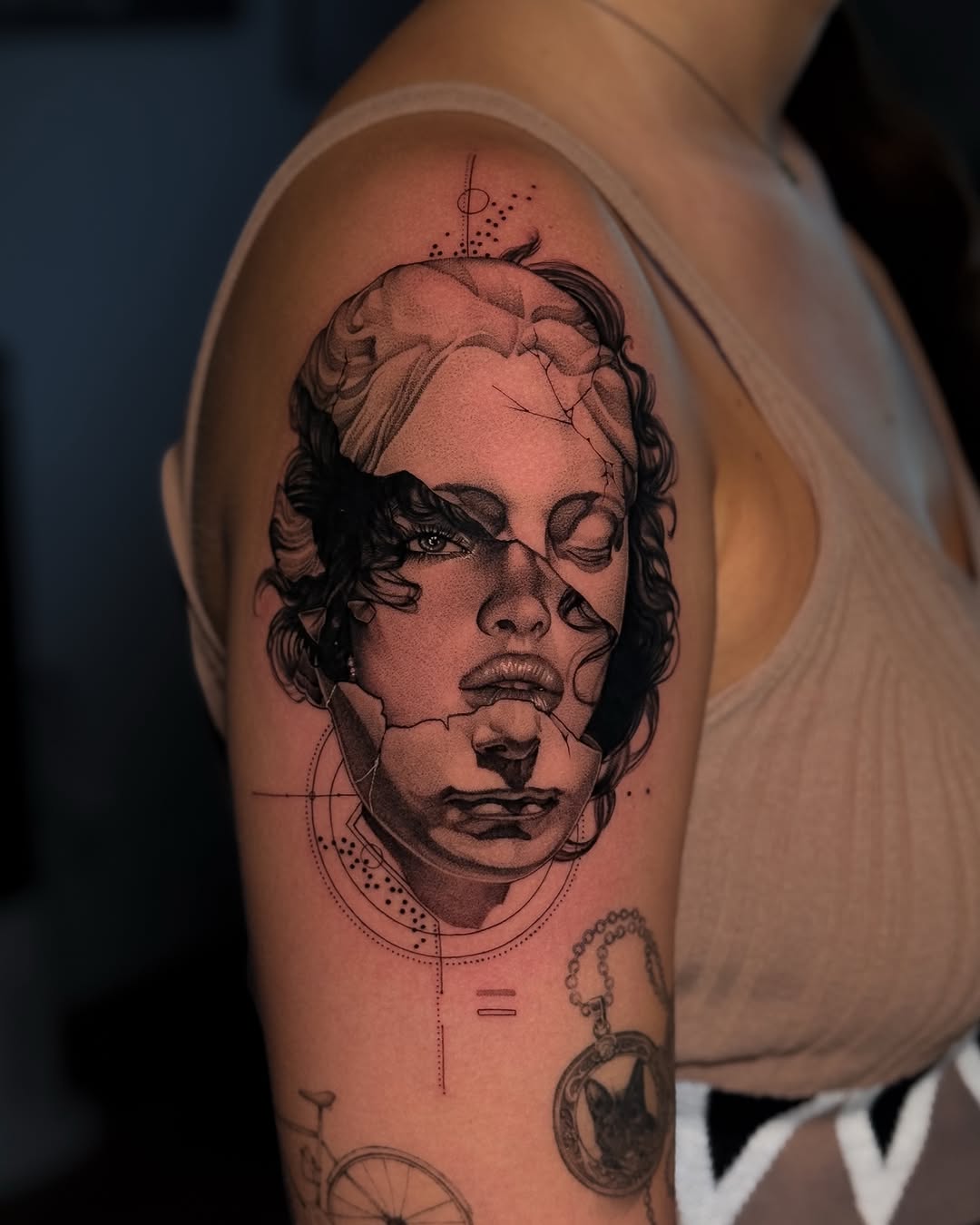 Broken face sculpture surrealism tattoo on the shoulder by ♡ 𝕍𝕚𝕔𝕥𝕠𝕣𝕚𝕒 ℍ𝕠𝕝𝕞𝕖𝕤 ♡, Avon, Ohio