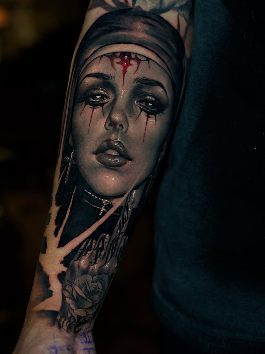 Nun portrait with rose realism tattoo on the forearm by Bailey Hancock