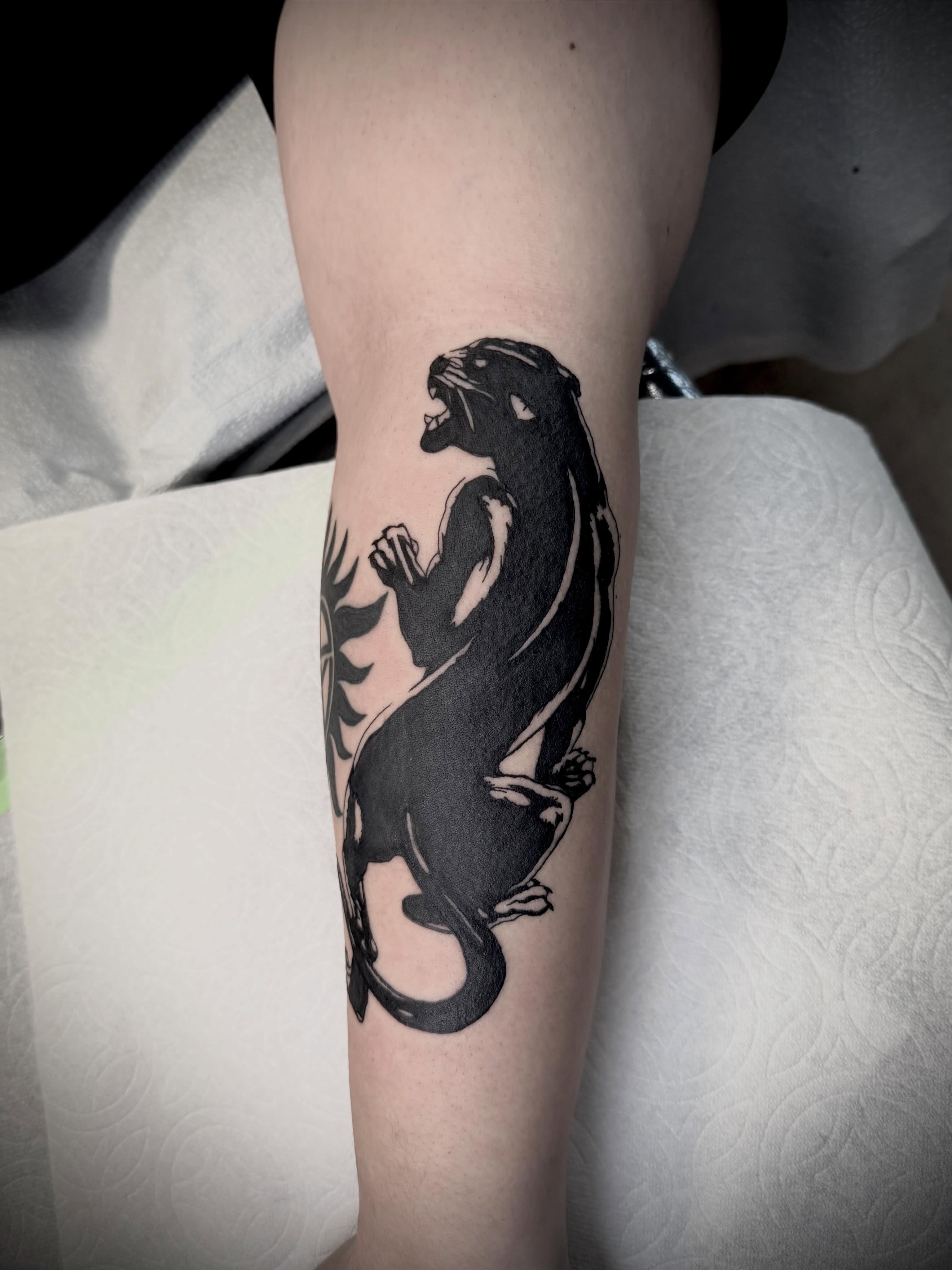 Panther black and grey tattoo on the forearm by San Diego Tattoo Artist