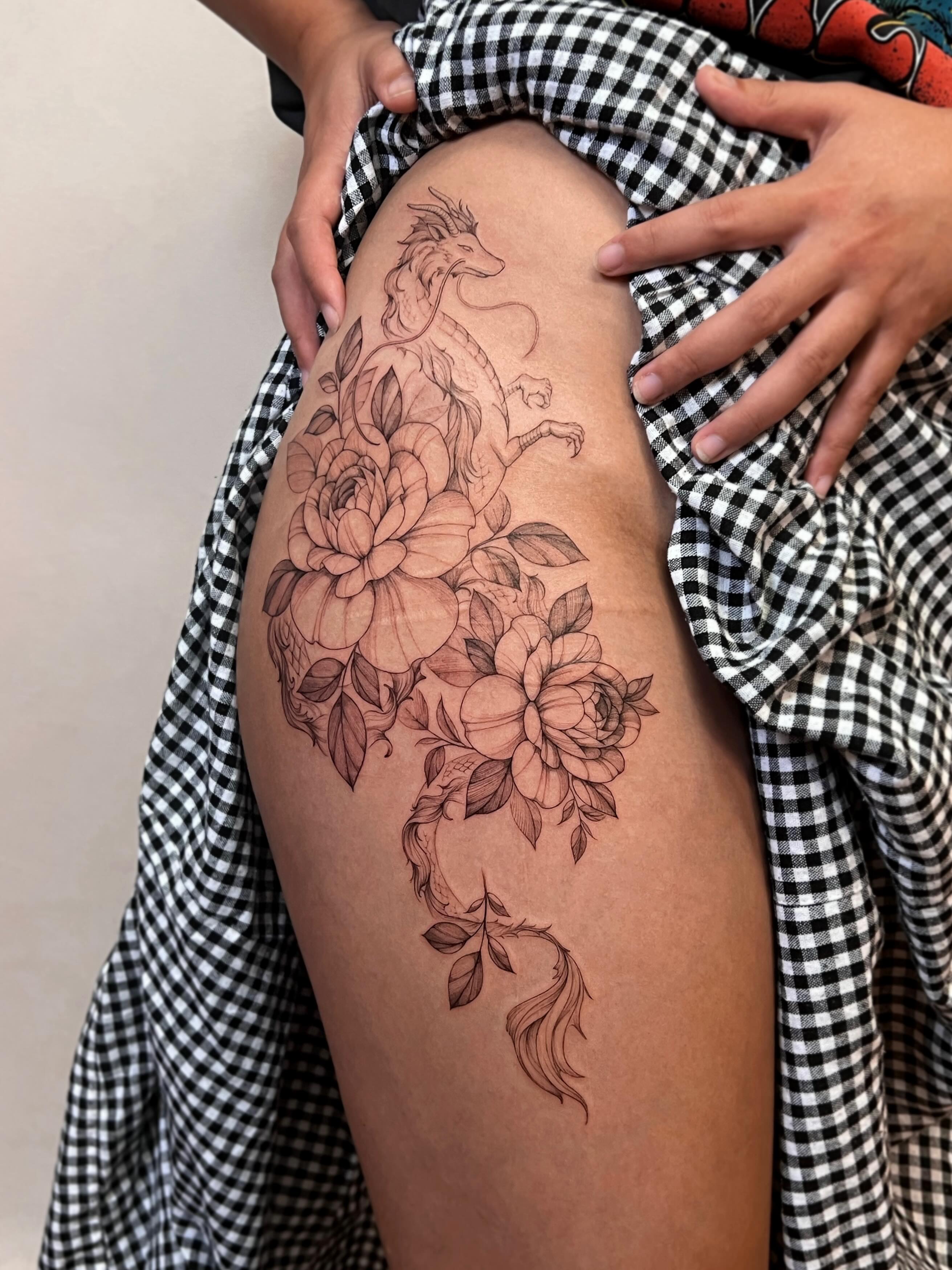 Dragon and flowers realism tattoo on the thigh by Hyn[hin]