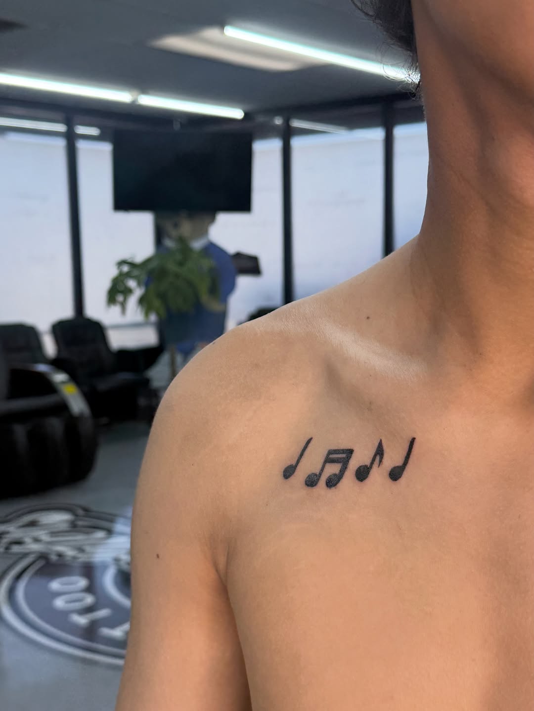 Musical notes minimalist tattoo on the chest by ⠀Greave