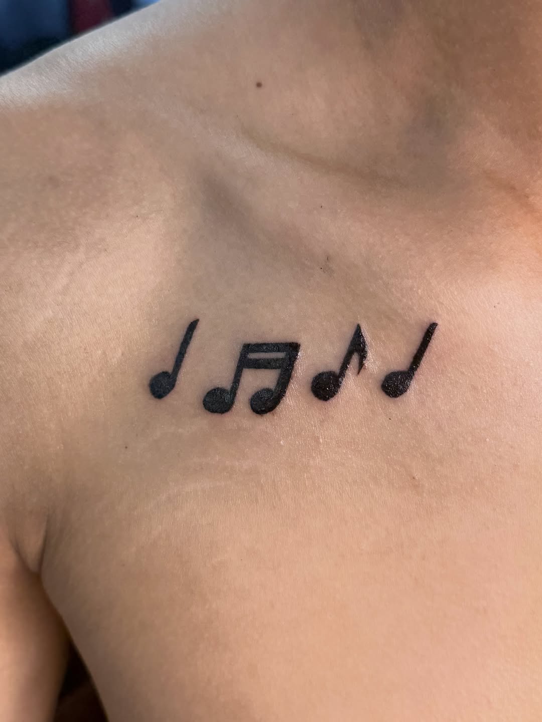 Musical notes tattoo on the chest by ⠀Greave