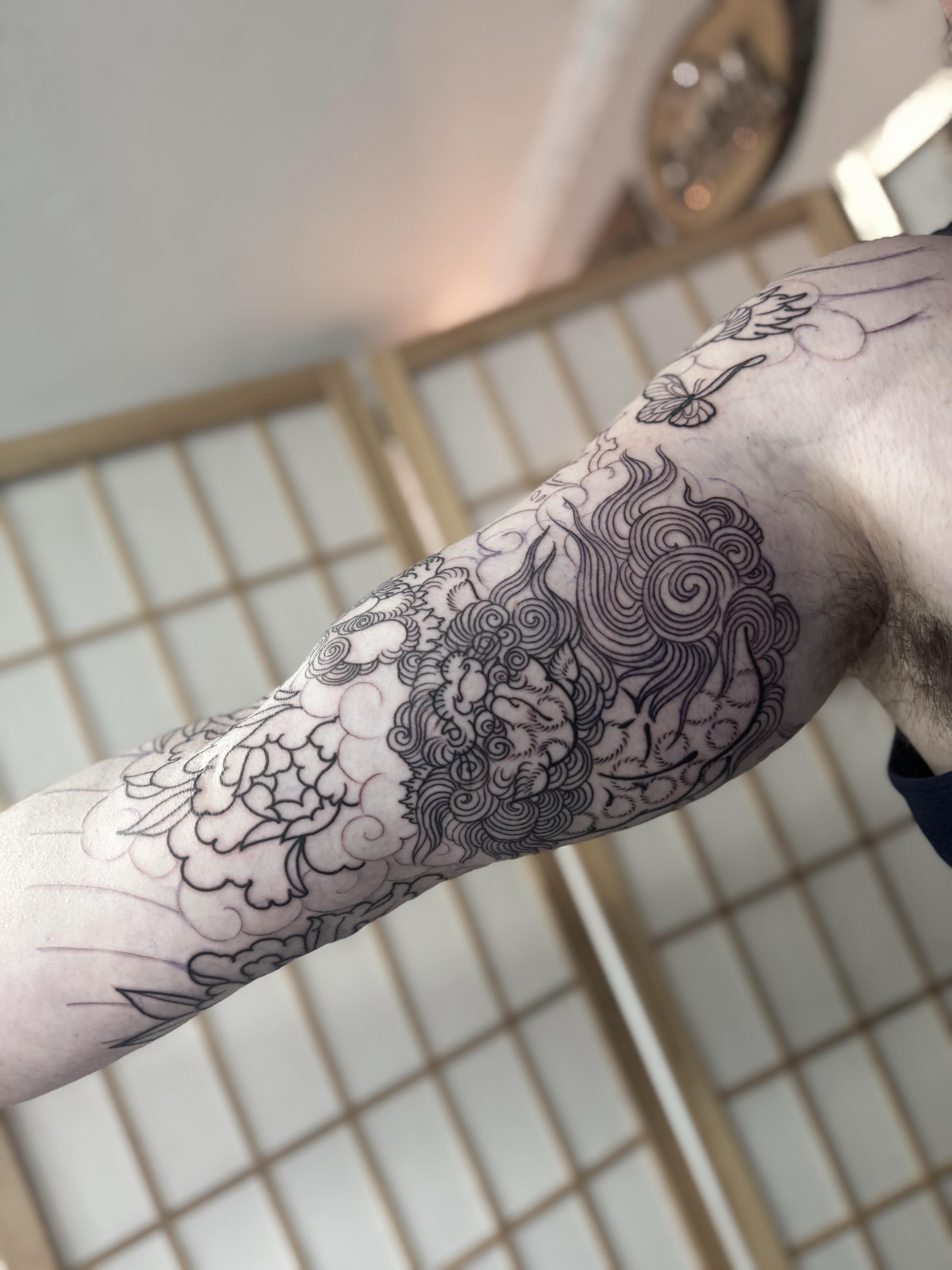 Clouds and floral motifs black and grey tattoo on the forearm by ⚔️ 𝕬𝖓𝖞𝖆 𝖁𝖎𝖈𝖙𝖔𝖗𝖎𝖆 ⚔️, Fairfax, Virginia