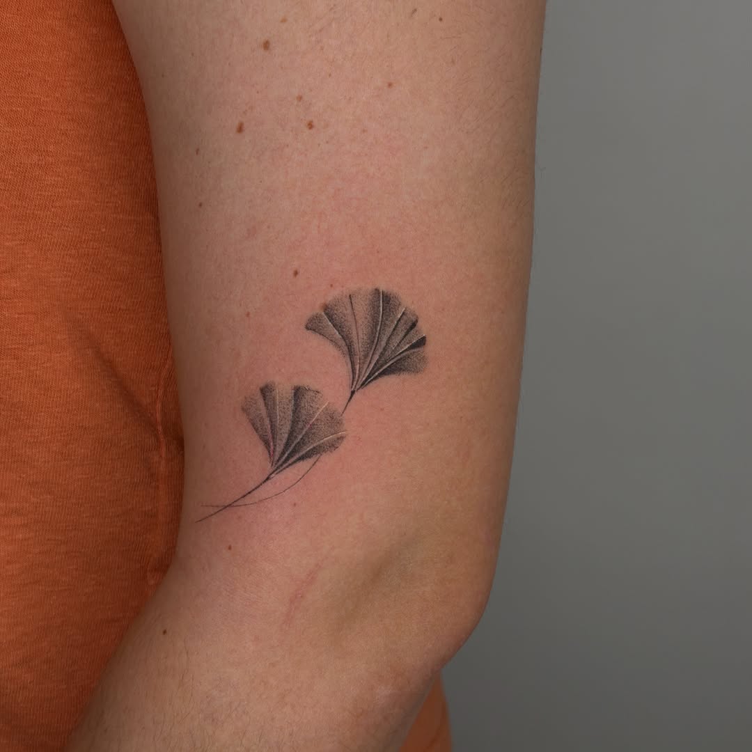 Ginkgo leaves fine line tattoo on the forearm by Vu Nguyen