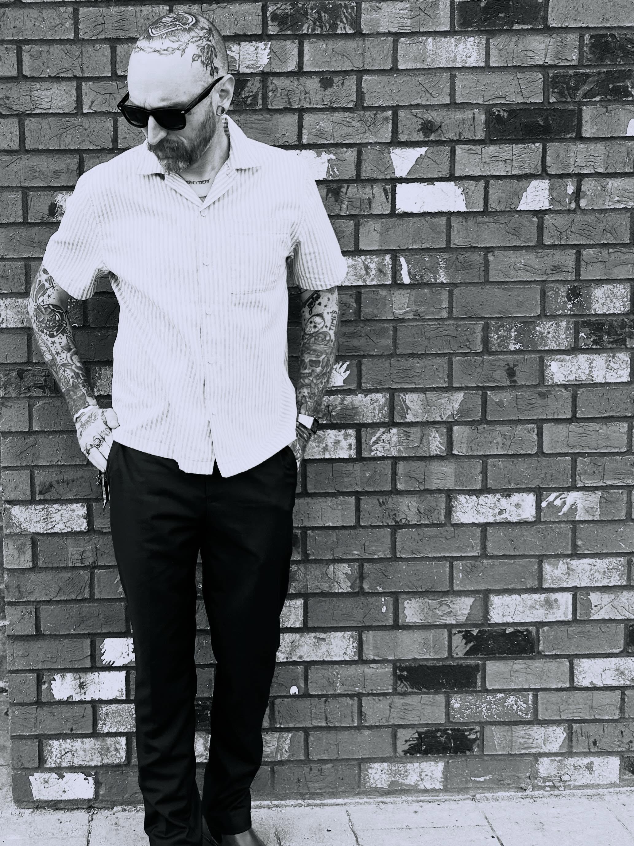Tattooed arms black and grey tattoo by Zach Andrews