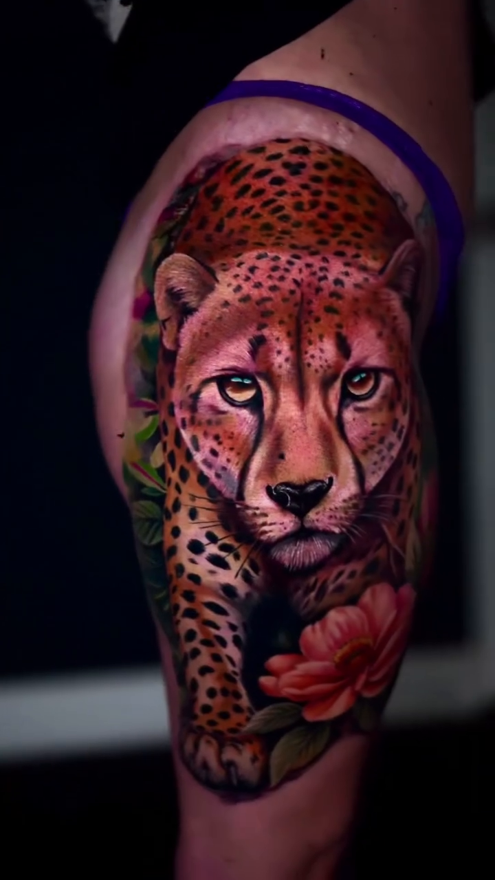 Cheetah with flowers realism tattoo on the forearm by Yasmani ramirez