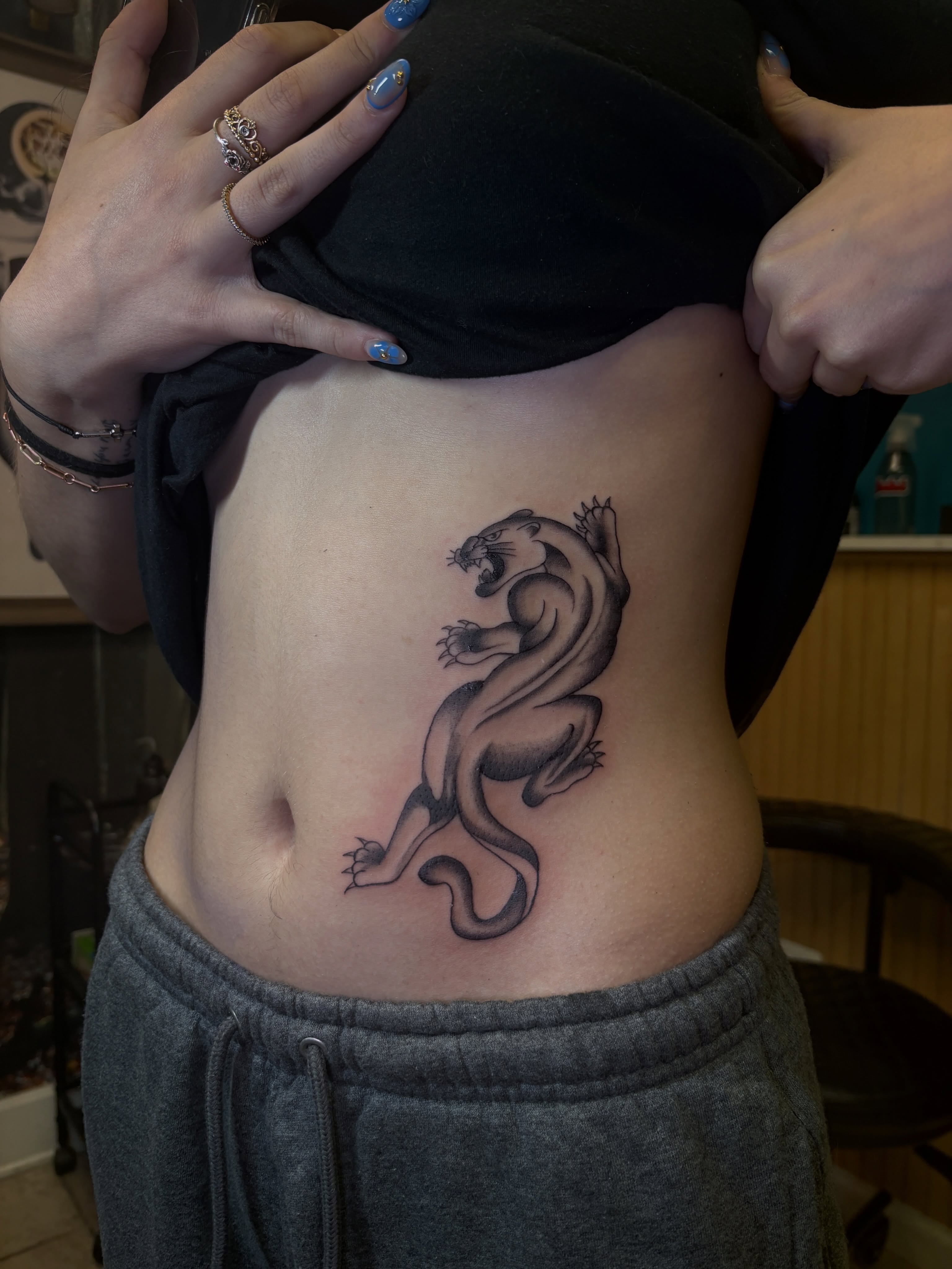 Otter black and grey tattoo on the ribs by ⋆.˚ ☾ .⭒˚ alaina