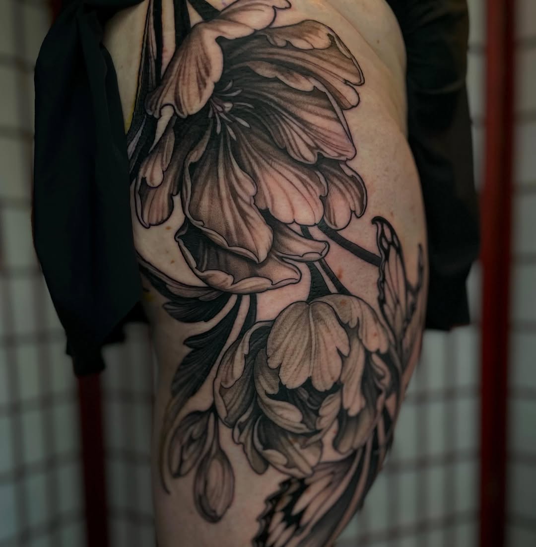 Tulips dotwork tattoo on the upper arm by Madelyn Roberts, Bellingham, Washington