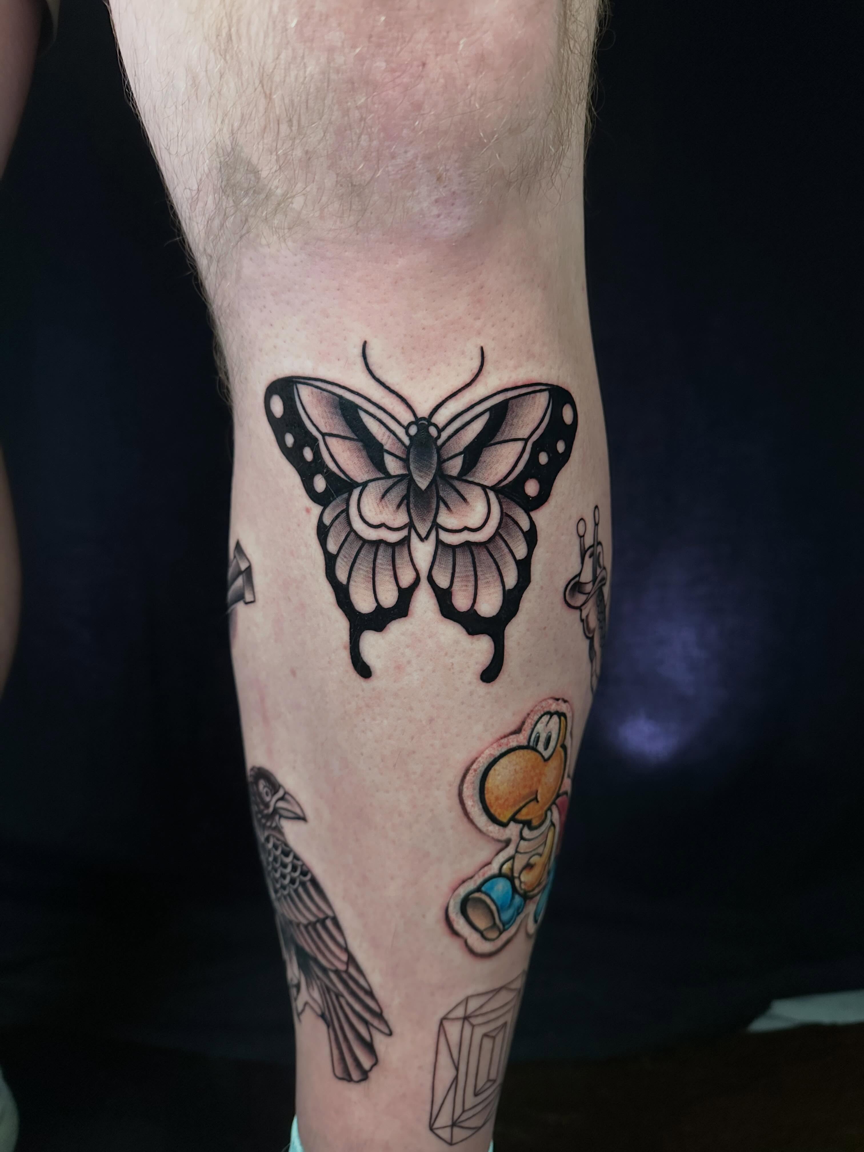 Butterfly dotwork tattoo on the calf by Chi, Charlotte, North Carolina