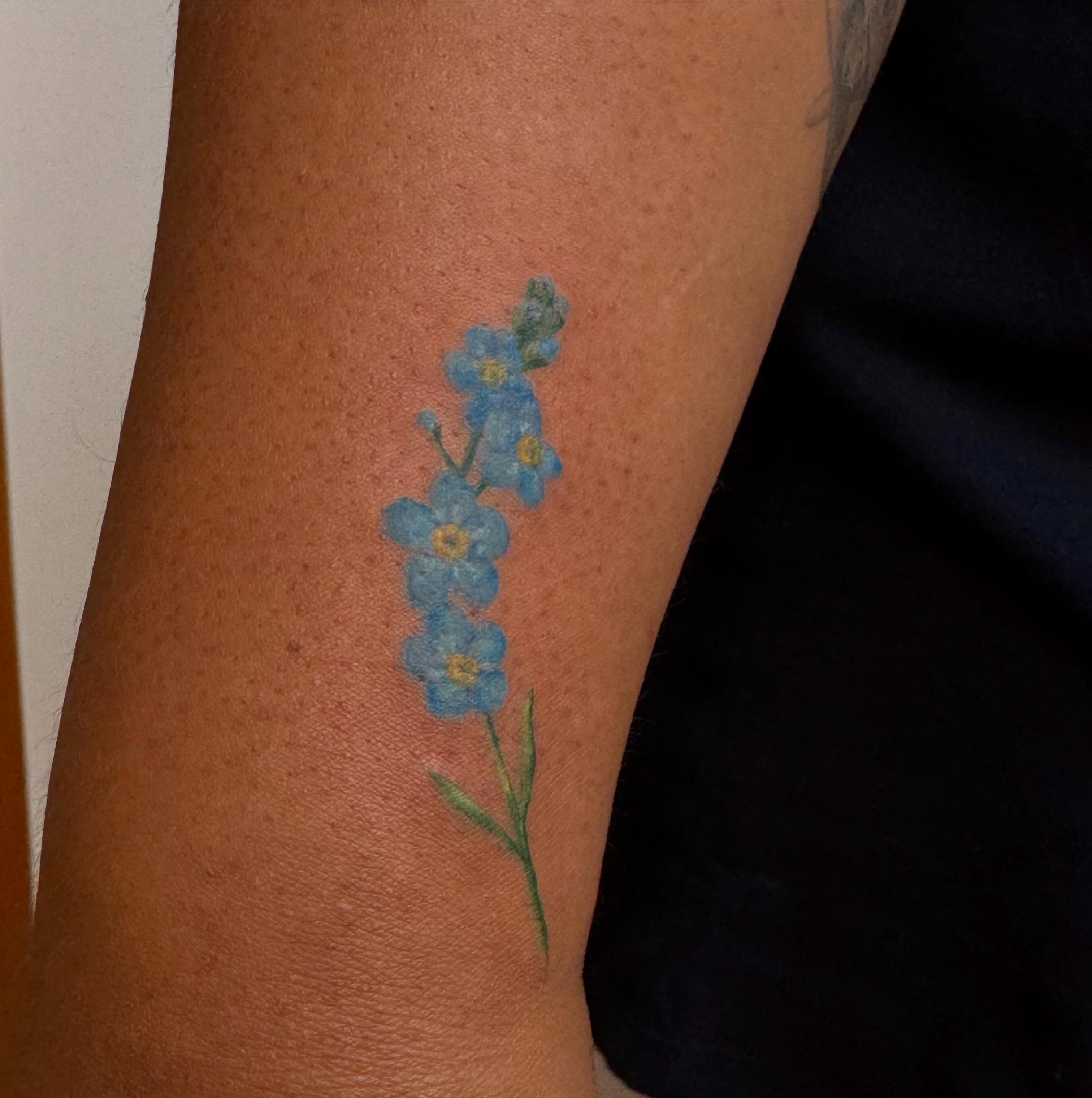 Forget-me-not flowers watercolor tattoo on the forearm by Enda 🧚🏻‍♀️