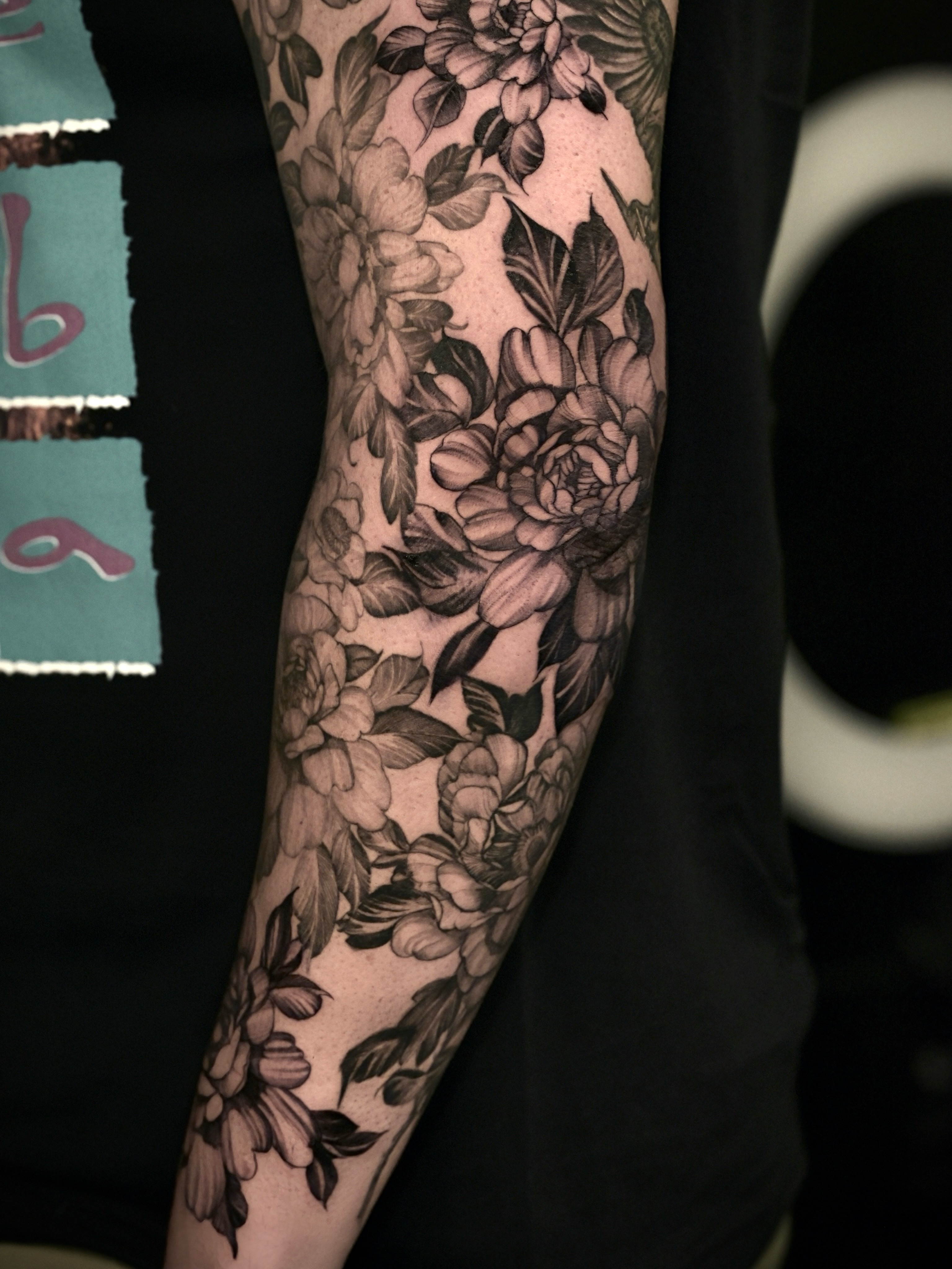 Floral bouquet realism tattoo on the forearm by Zonghuan Wu