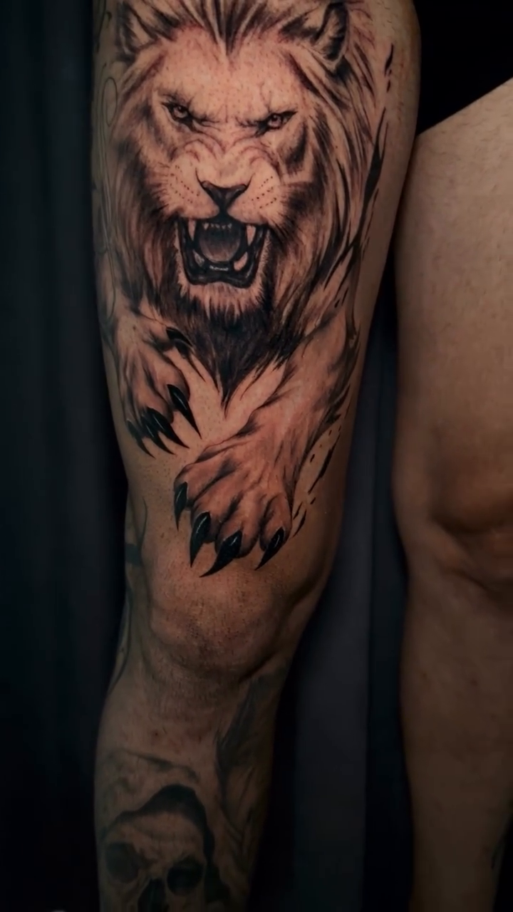 Fierce lion portrait on thigh realism tattoo on the forearm by Mali Sarsılmaz, Nicosia, Cyprus